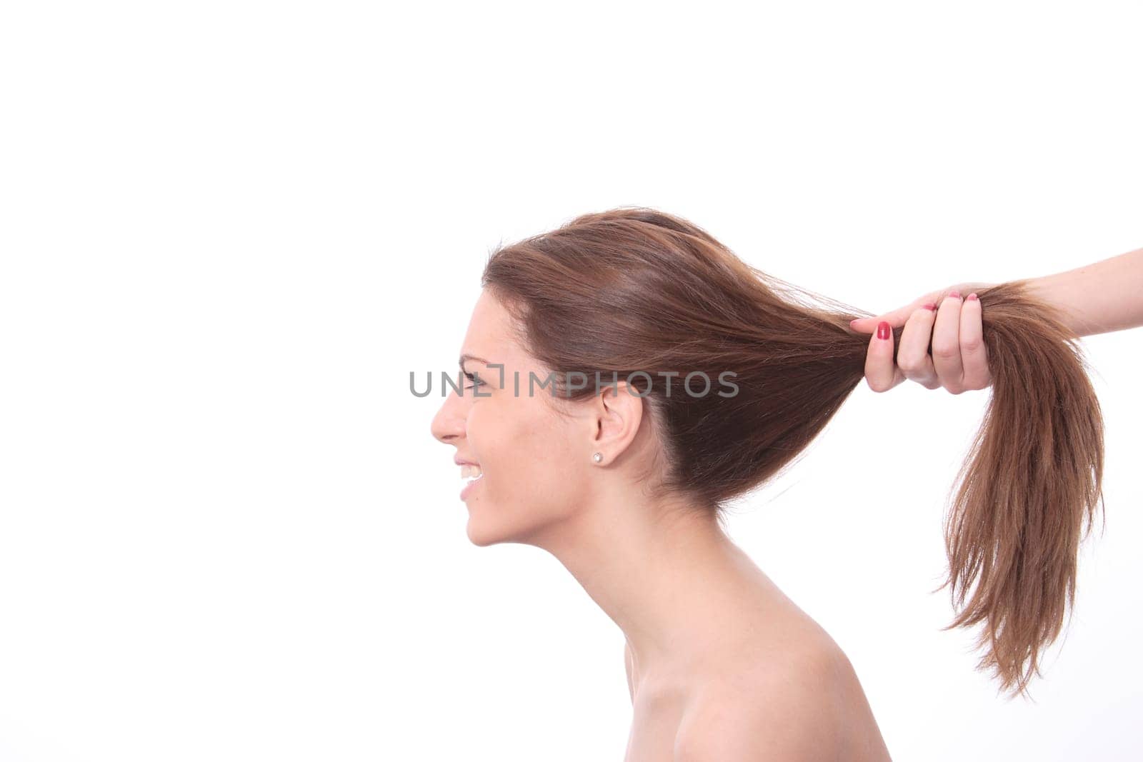 Closeup portrait of a happy young woman smiling isolated on white background