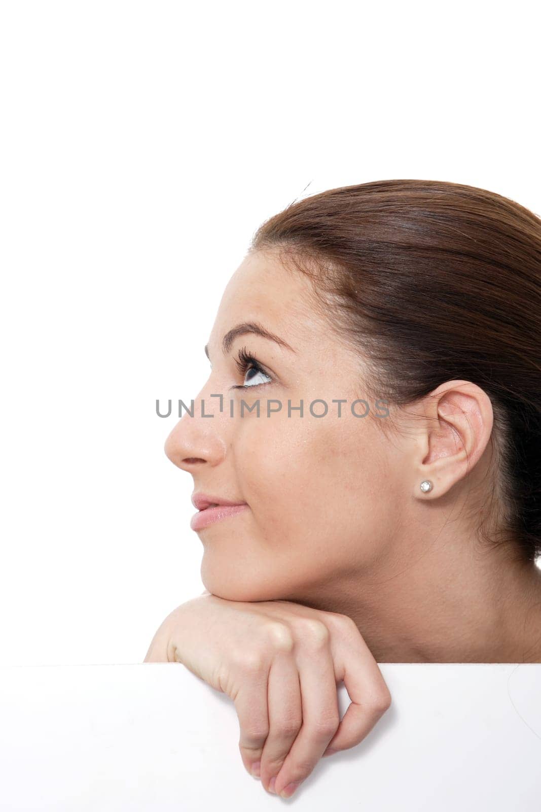 Closeup portrait of a happy young woman smiling isolated on white background