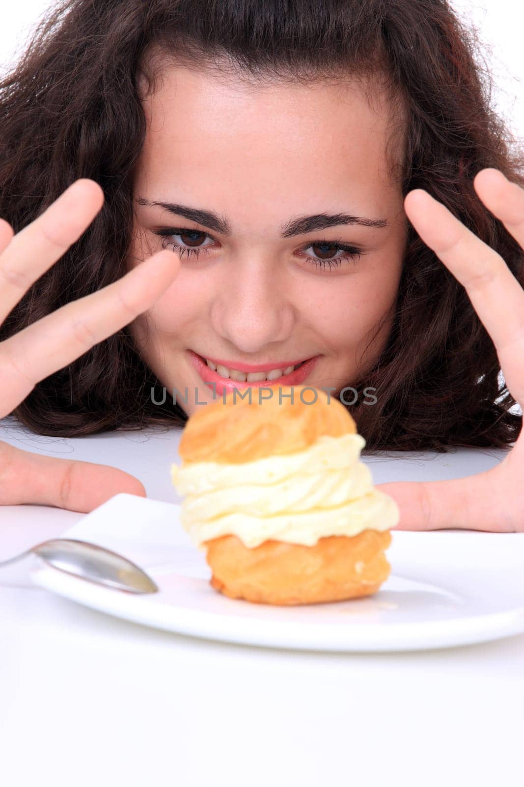 Young girl eating a yumy cake