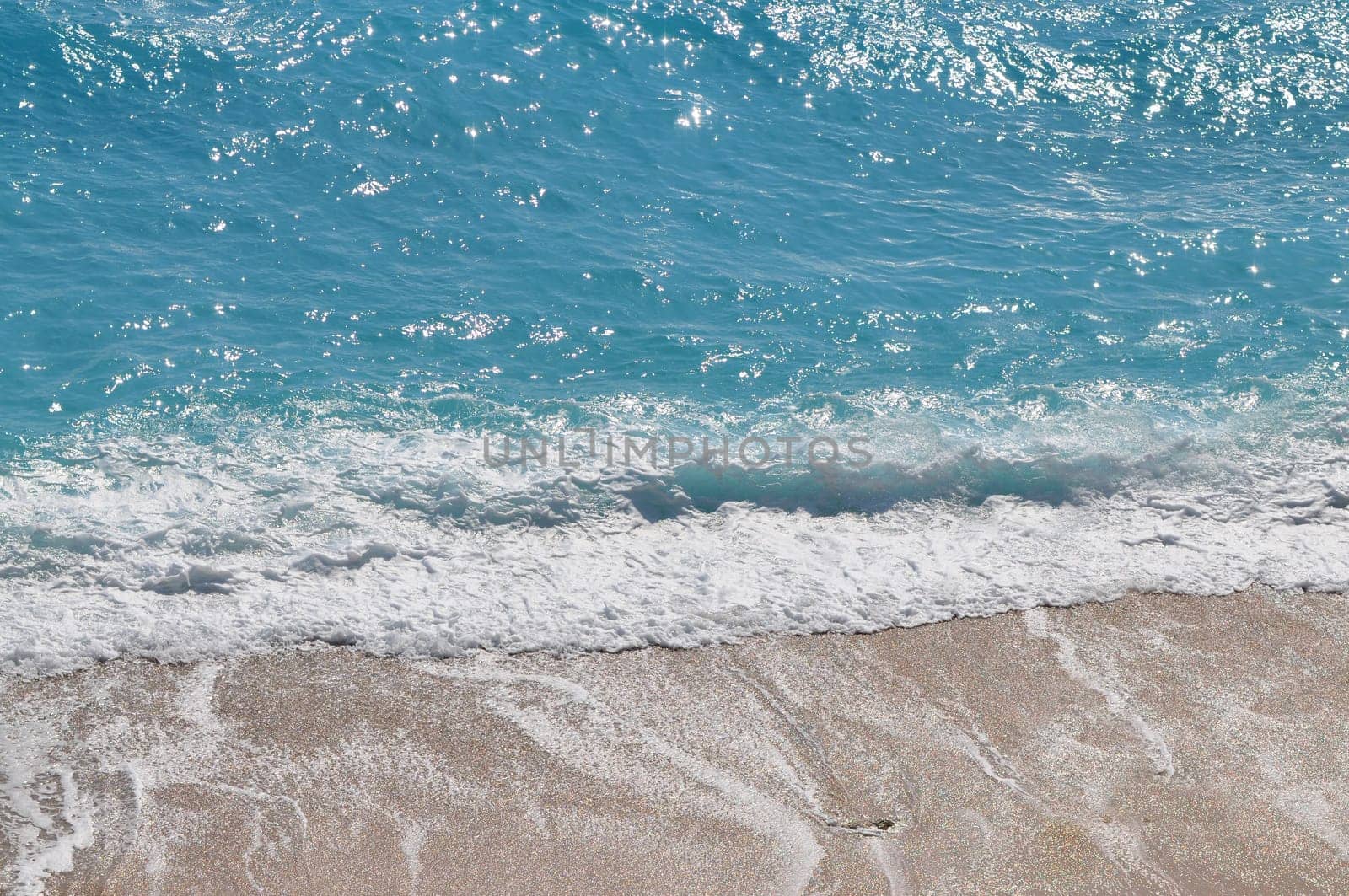 Beach wave and blue sea foam