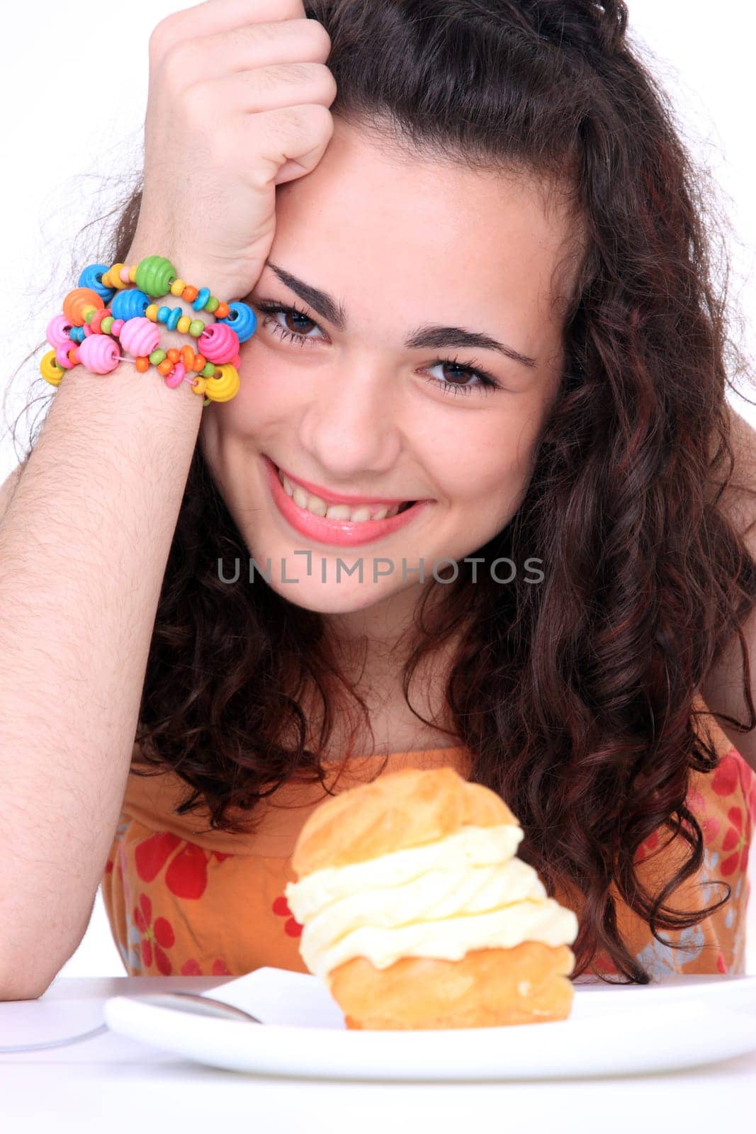 Young girl eating a yumy cake