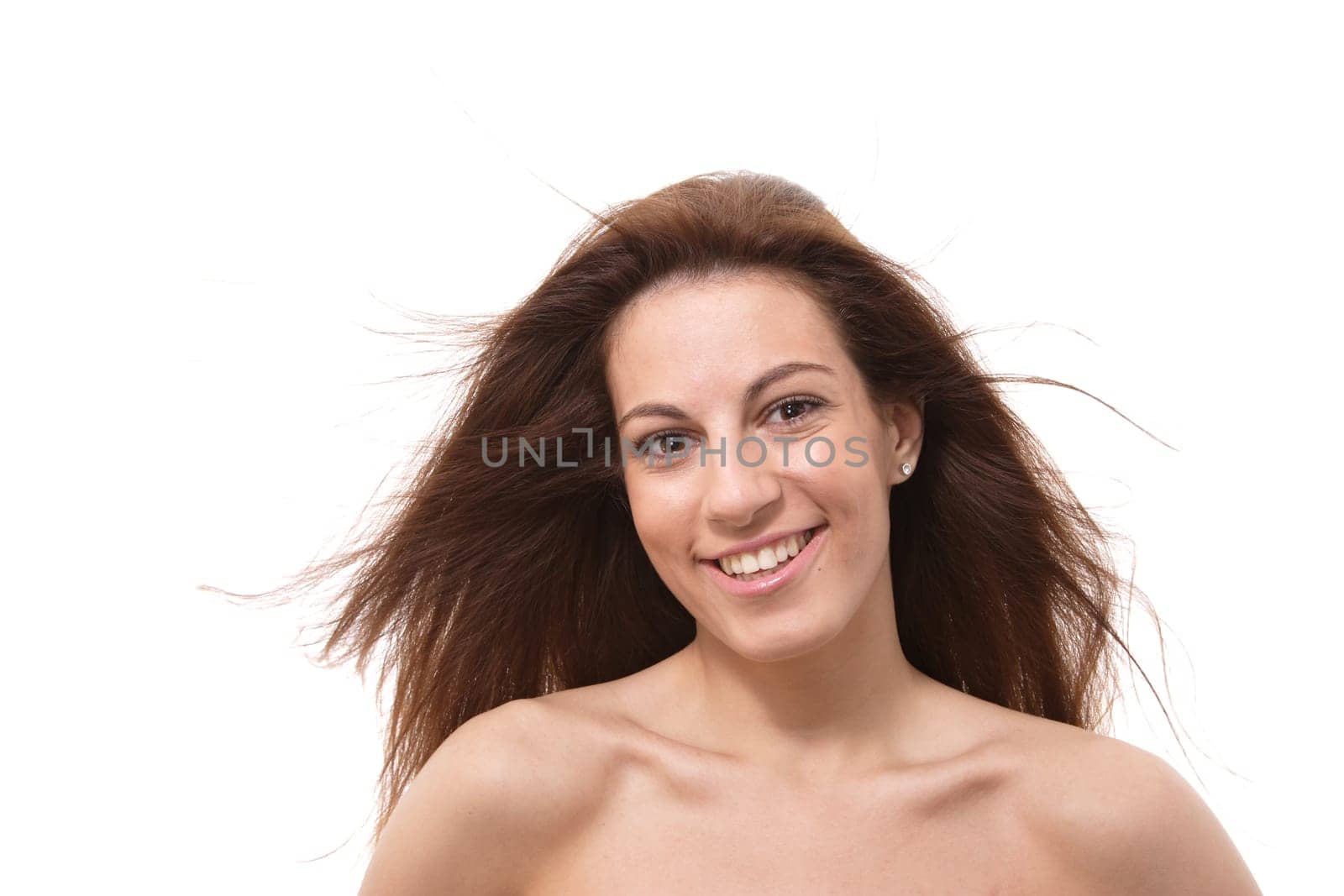 Closeup portrait of a happy young woman smiling isolated on white background