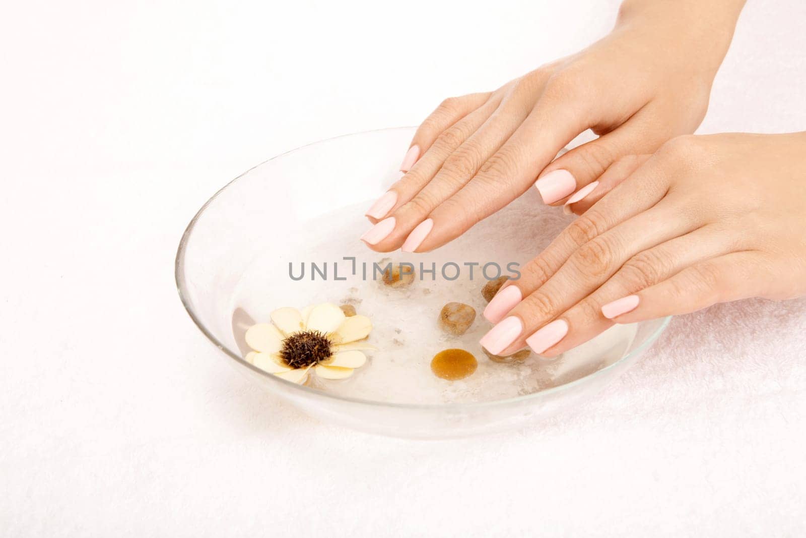 Female hands in the salt tray, isolated
