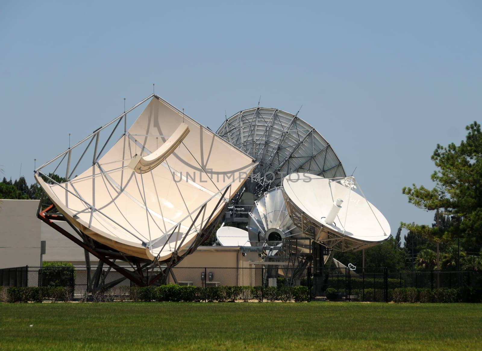 Array of giant satellite antennas pointing in the sky