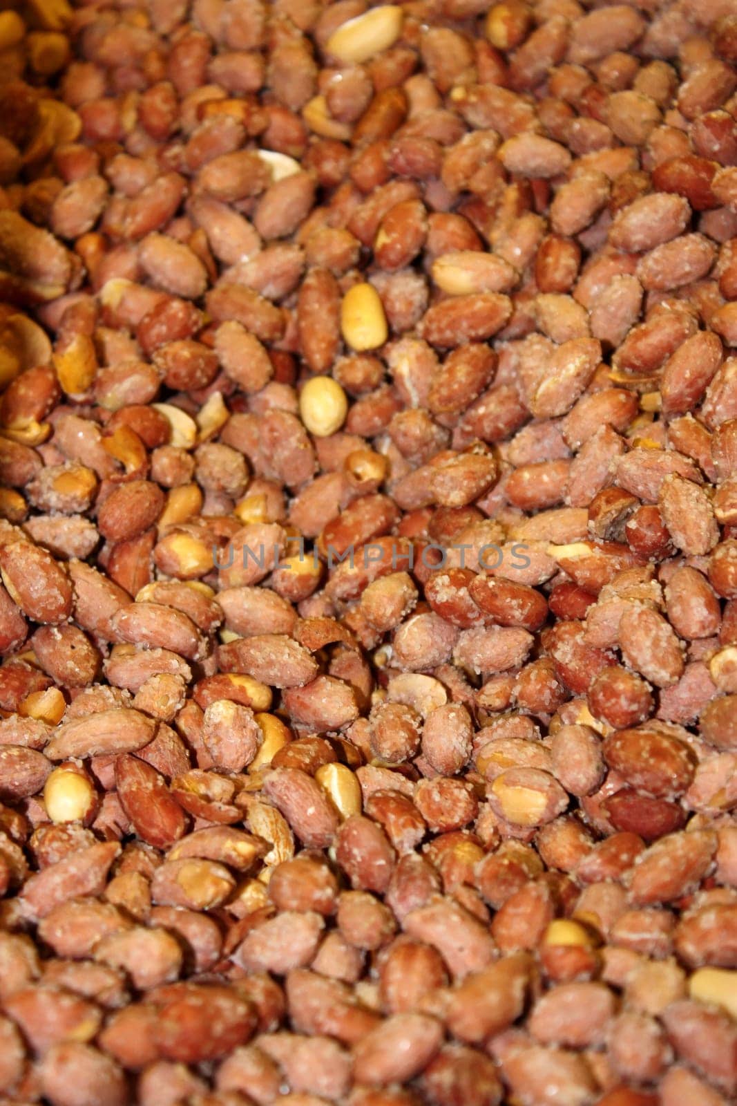 Salty peanuts  background - vertical