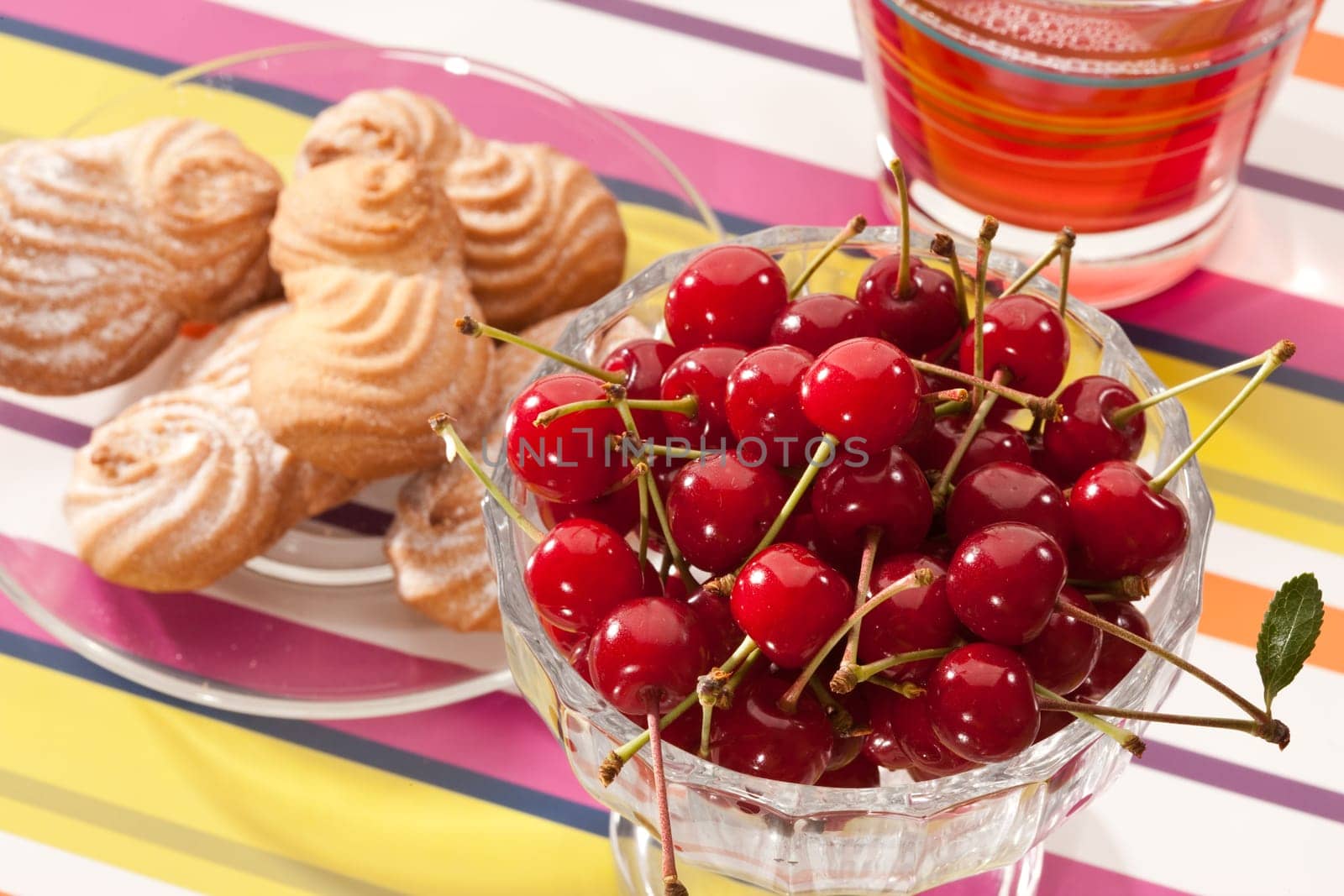 food series: cherries in glassy bowl with pastry and compote