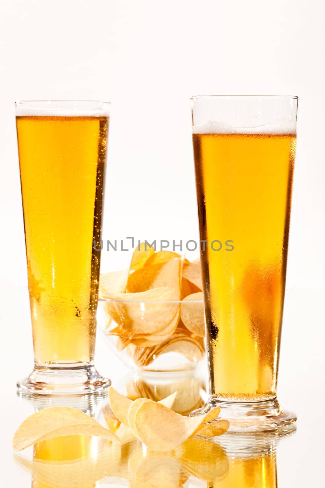food series: two glasses of beer and a chip