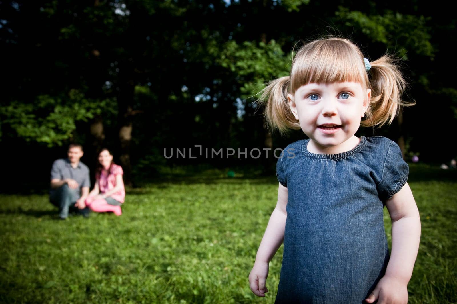Little Girl Portrait On The Natire Background
