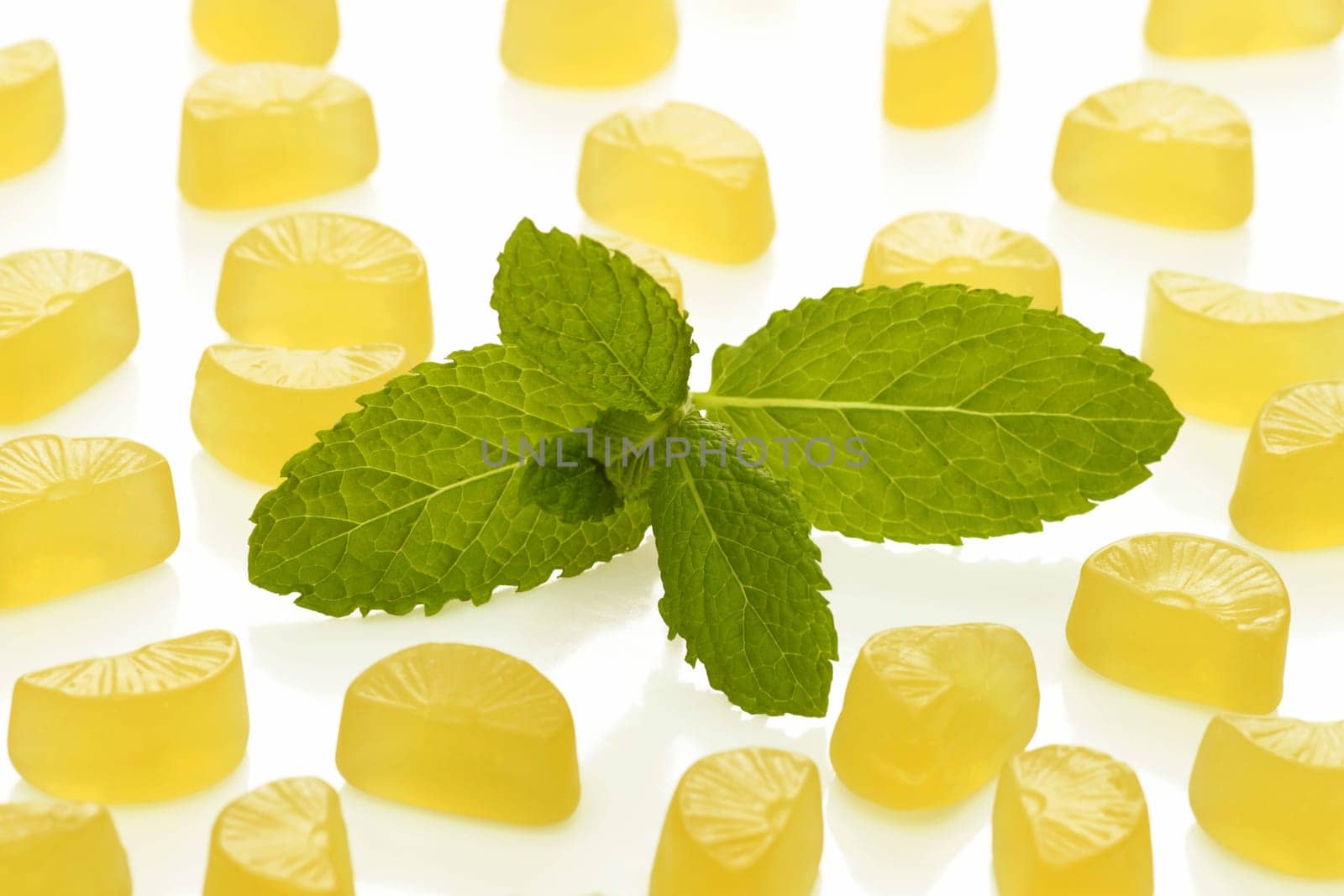 Brightly coloured wine gums on bright background