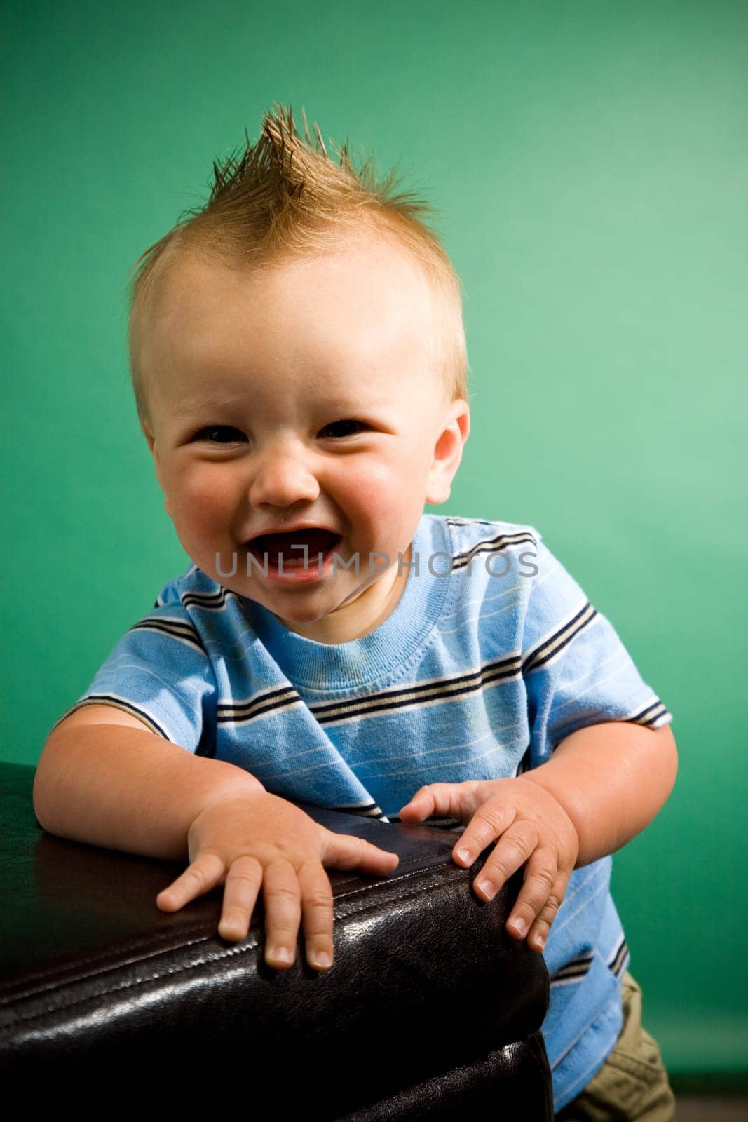 A portrait of a cute nine month old baby boy.