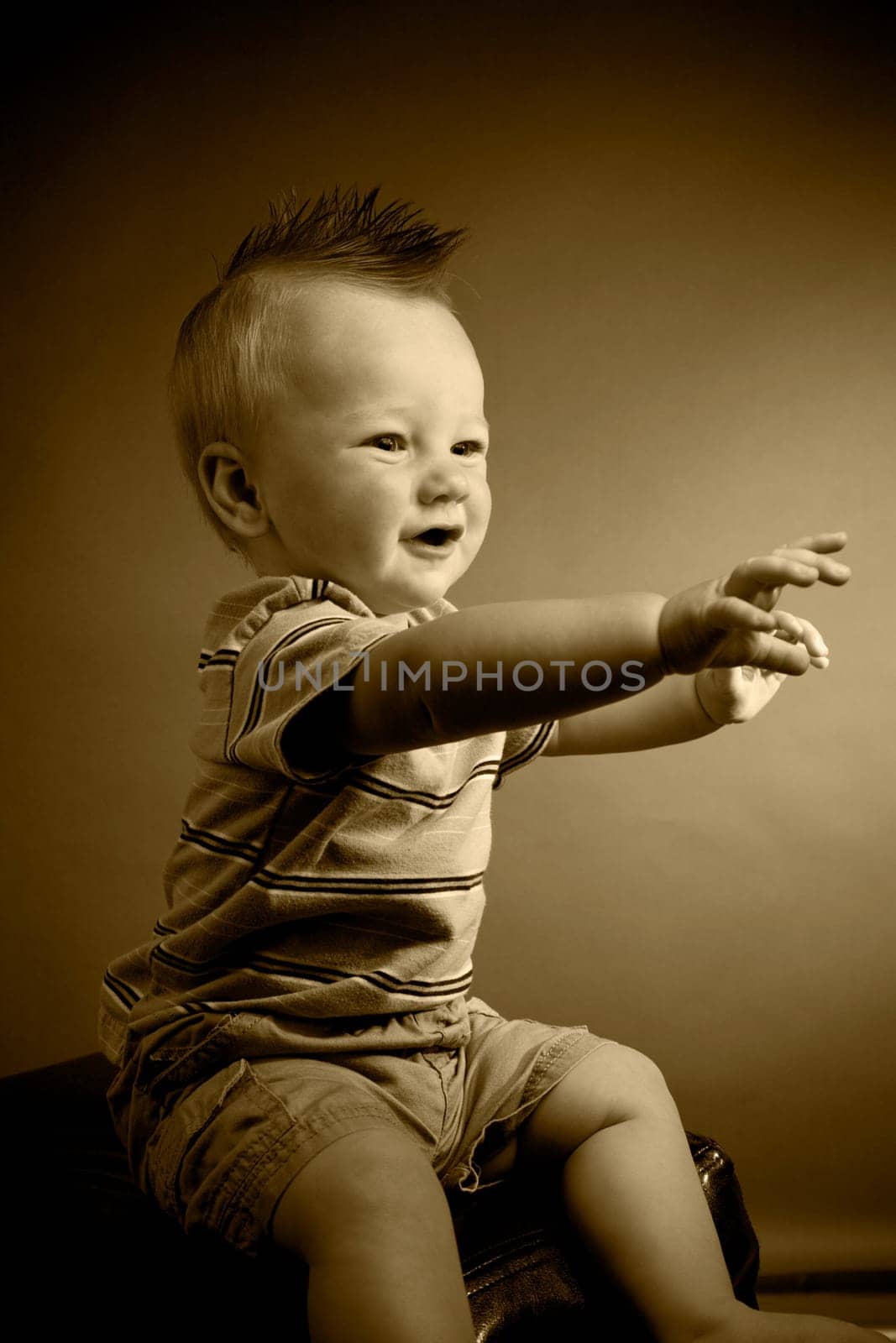A portrait of a cute nine month old baby boy.