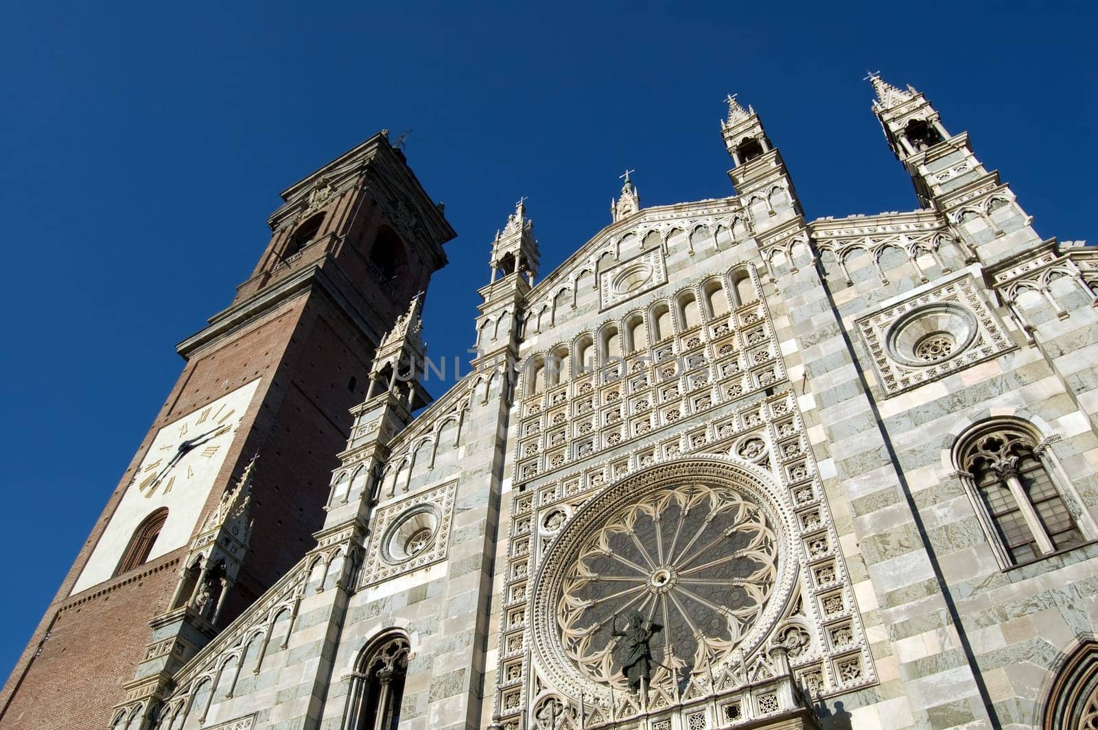 Duomo of Monza facade with the belfry and the rose window