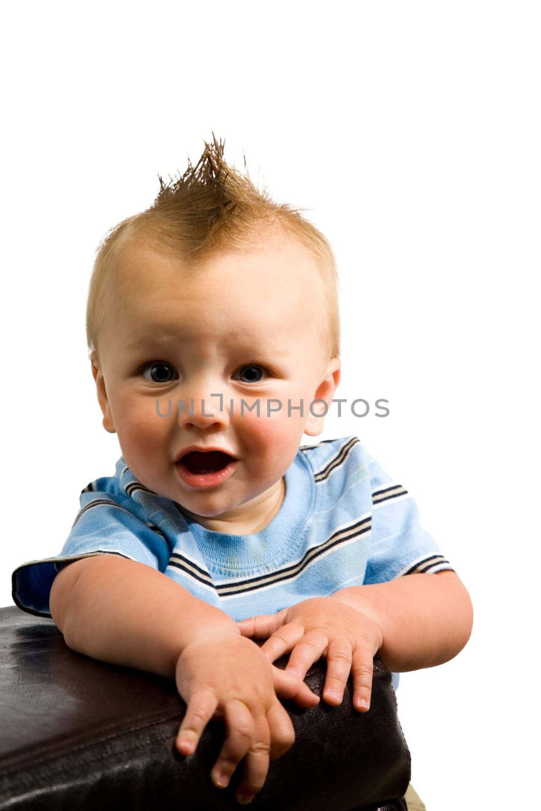 A portrait of a cute nine month old baby boy isolated on a while background.