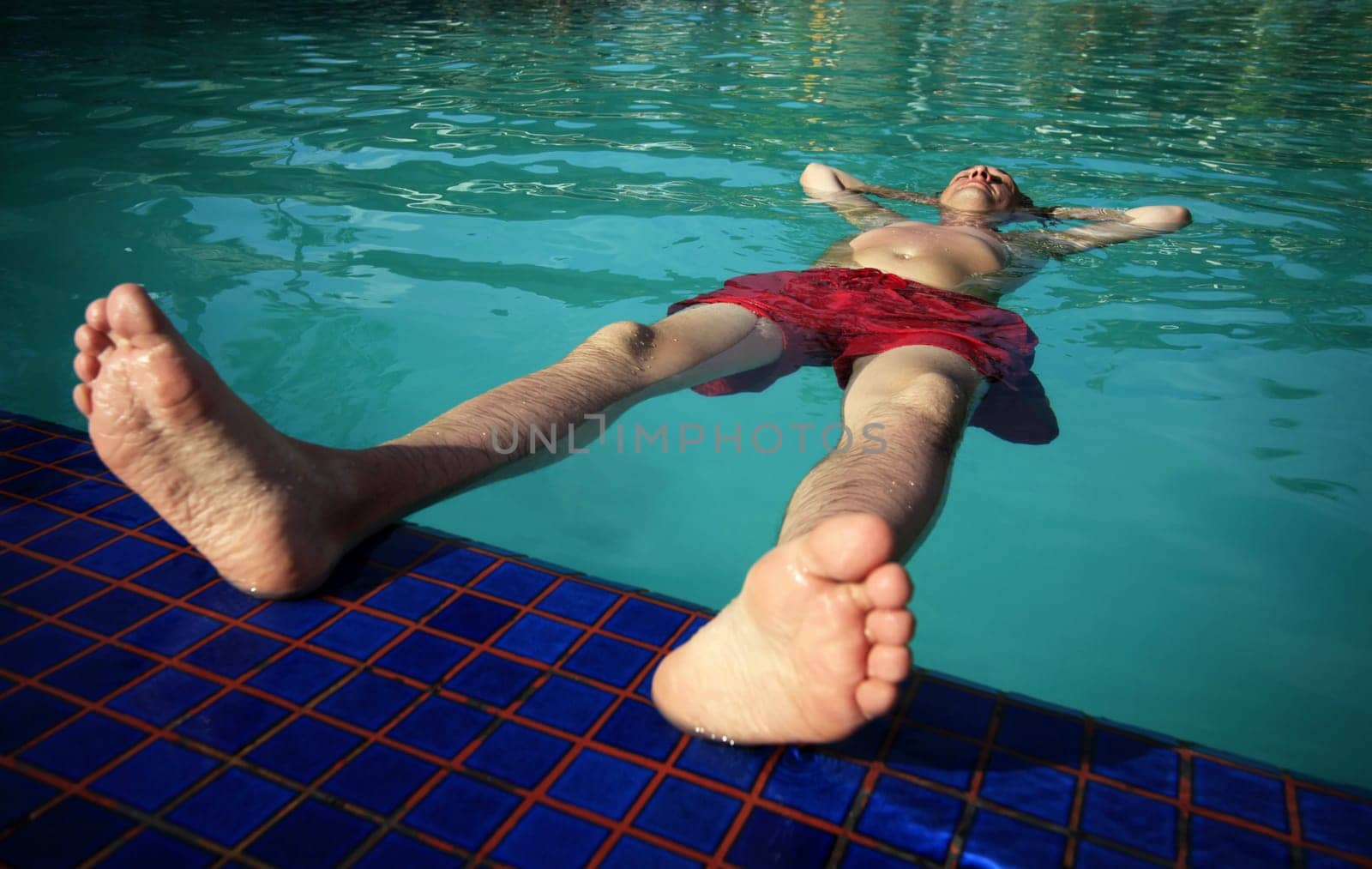 Man enjoying summer in the pool