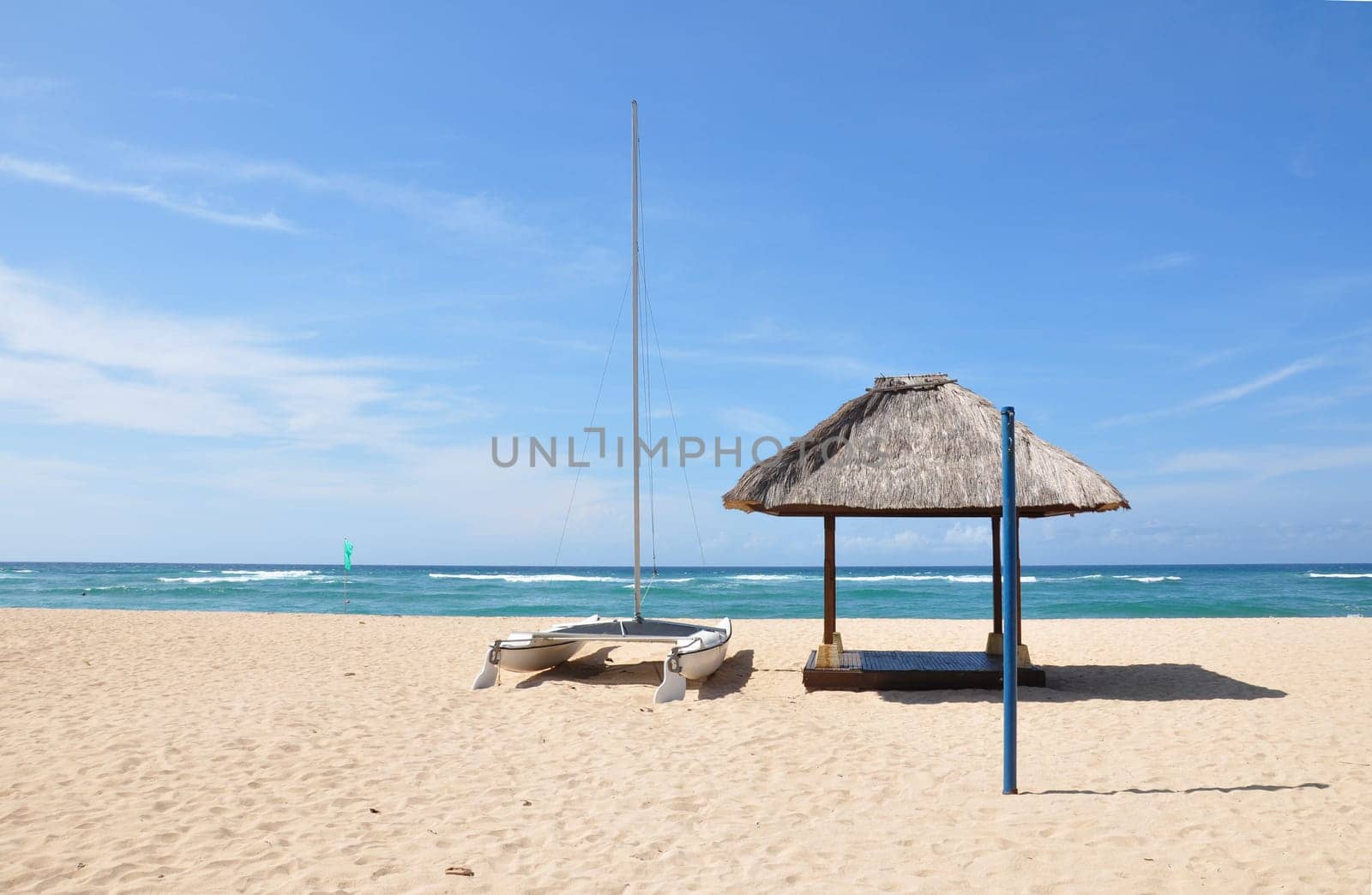 Boat on the empty Nusa Dua beach, Bali, Indonesia