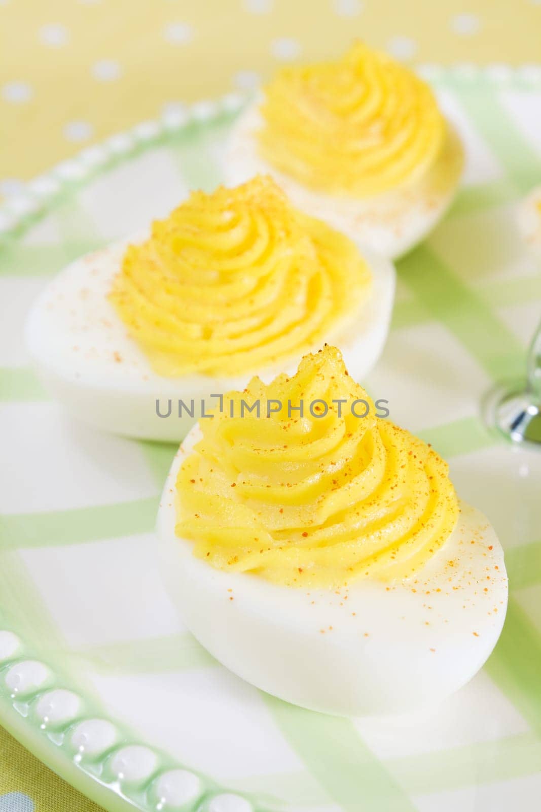 Deviled eggs sprinkled with paprika.