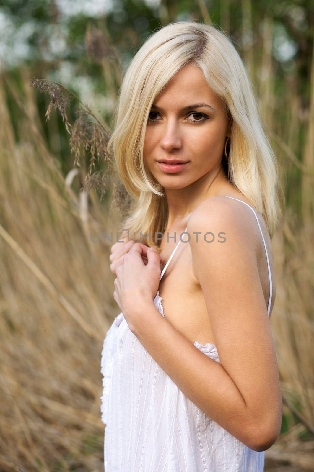 Portrait of a young beautiful woman in a countryside
