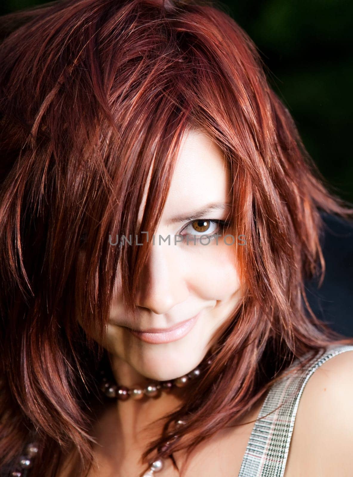 Woman With Red Hair. Close-Up Portrait