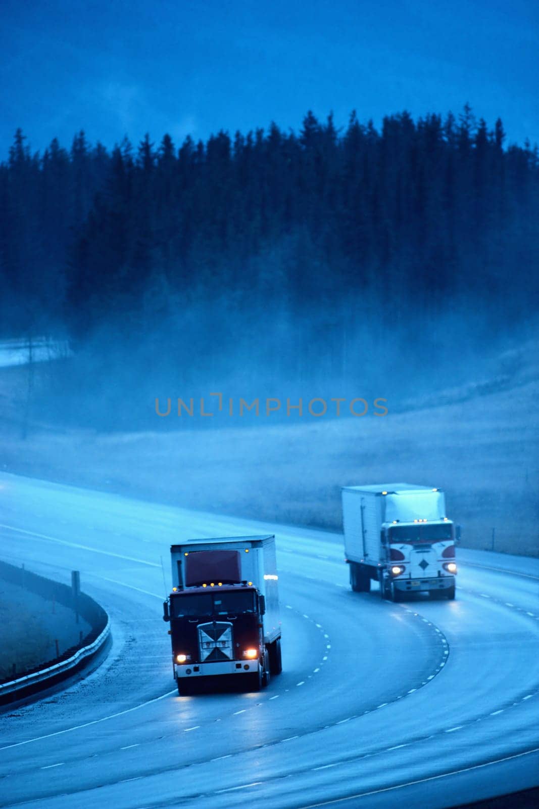two auto tracks on the road