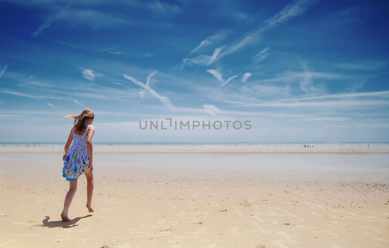 Young girl having fun on the beach