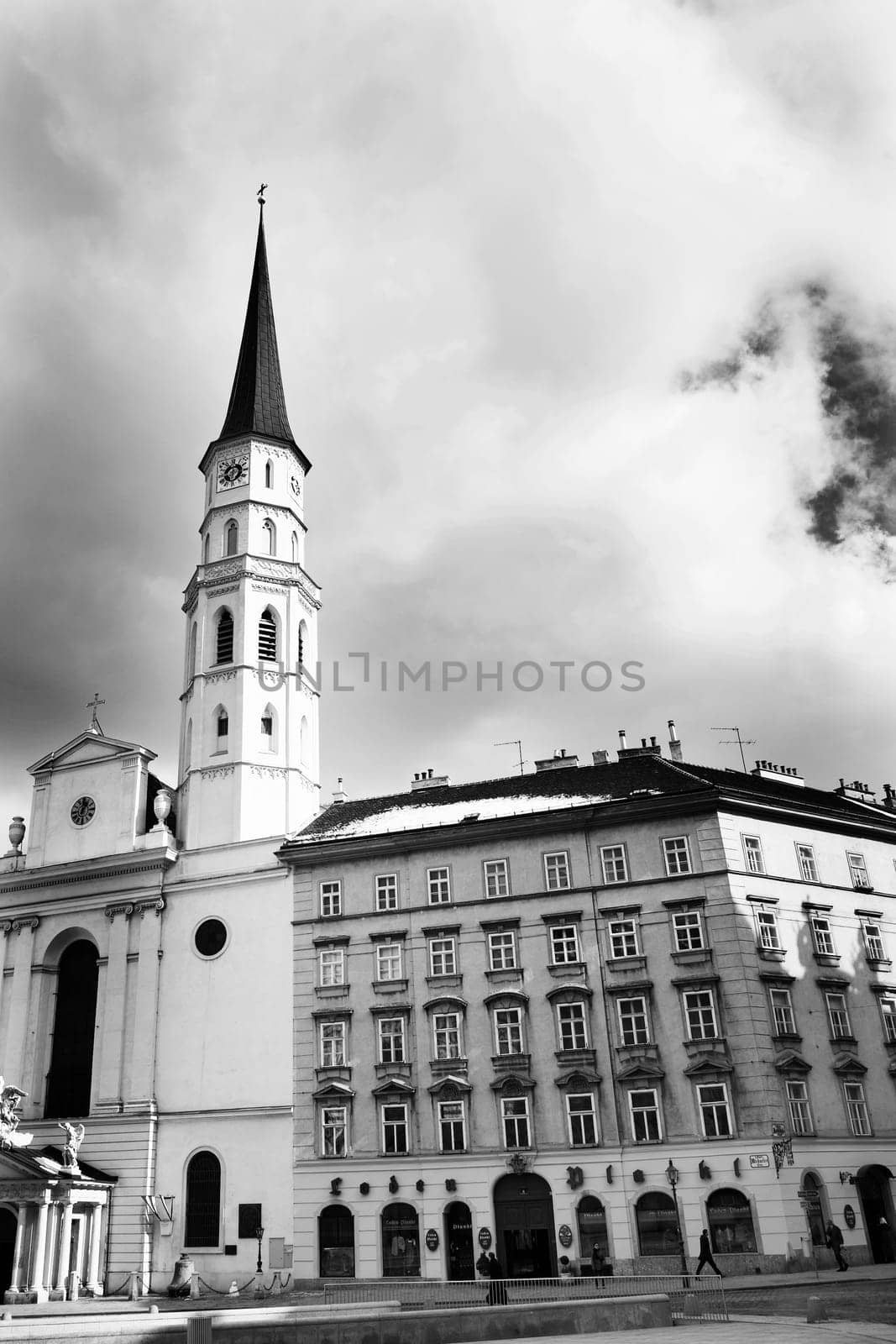 Tall building with tall tower in Vienna, Austria. Black and white