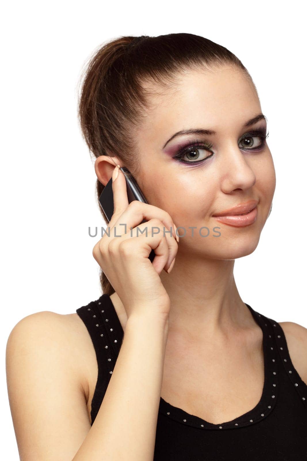 Close up of attractive young woman talking on a mobile phone over white