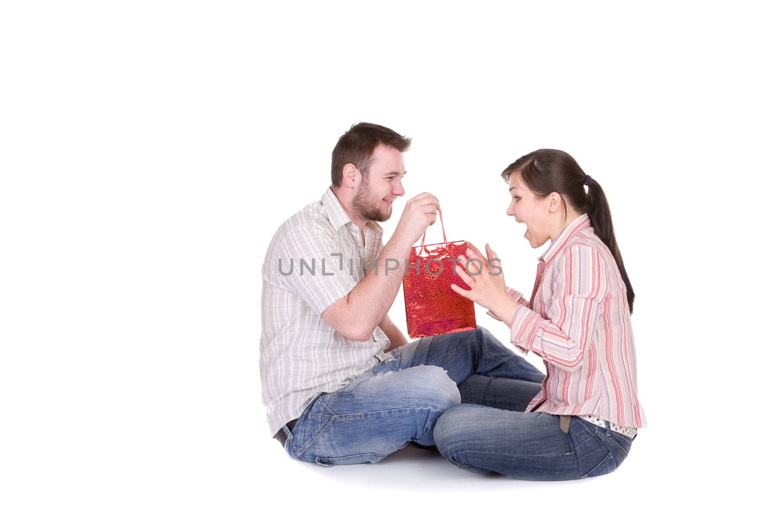 happy young couple together on white background