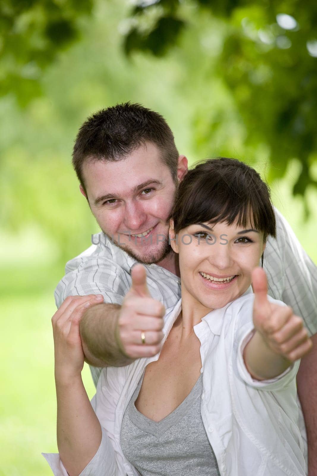 happy young couple relaxing in park