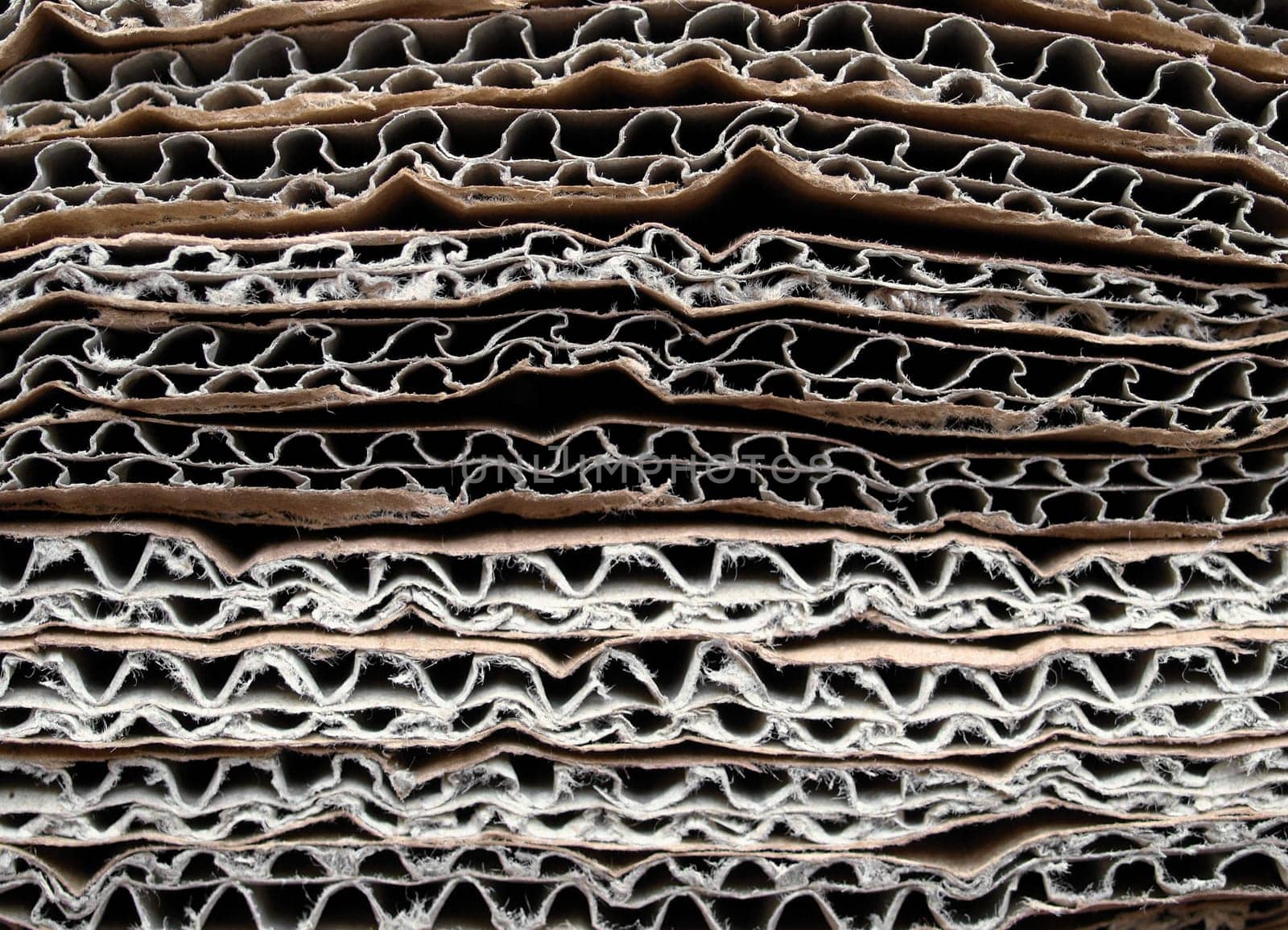 Brown corrugated cardboard sheet useful as a background