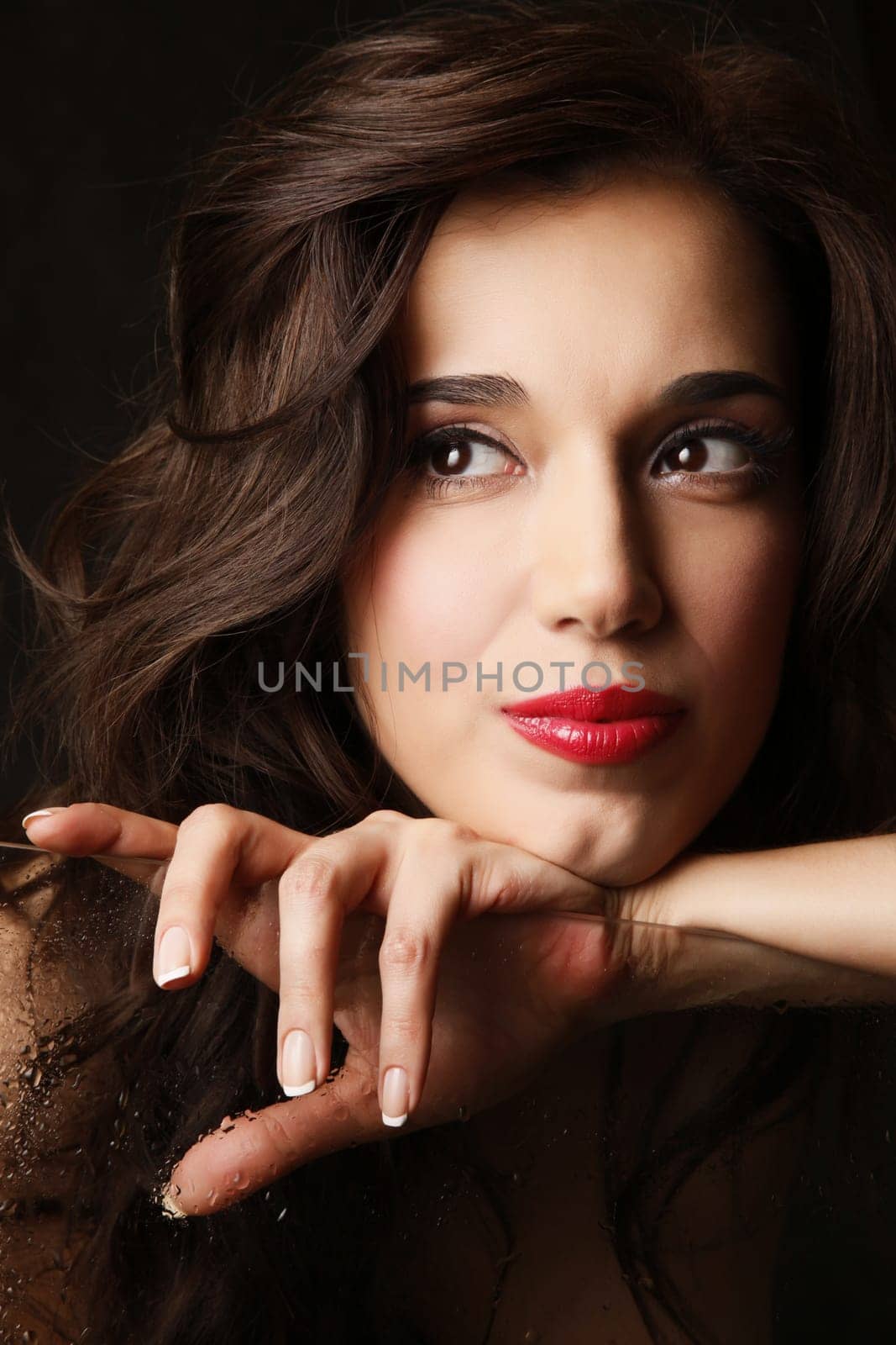 Portrait of the beautiful brunette in studio