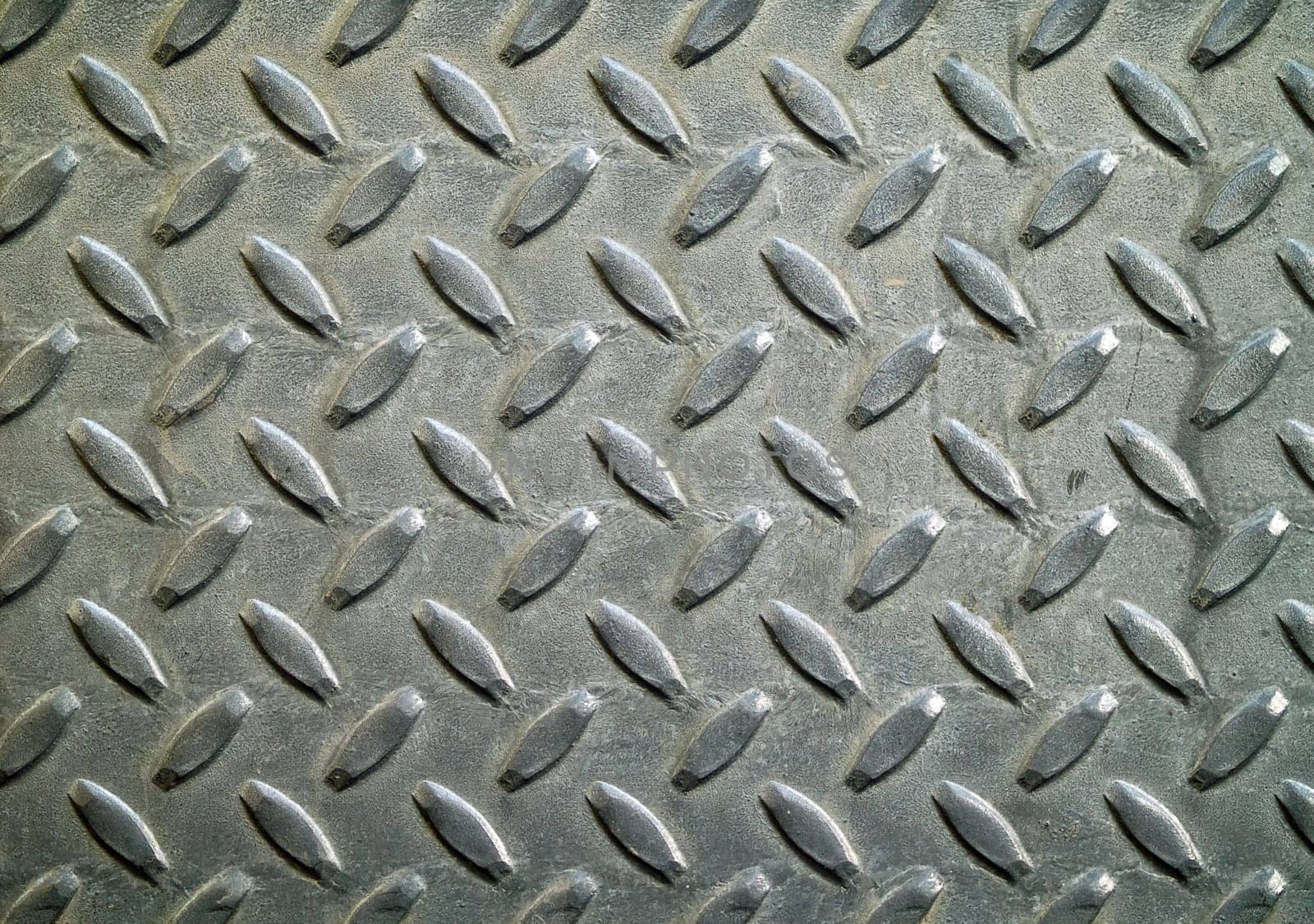 Diamond metal background texture illuminated by sunlight