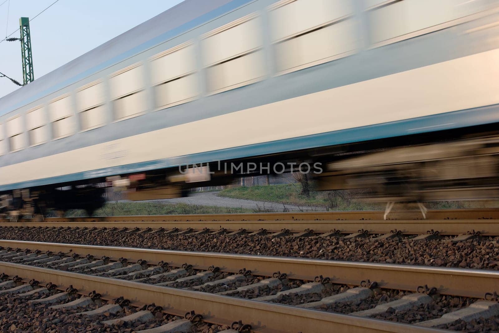 Passenger train passing by with motion blur