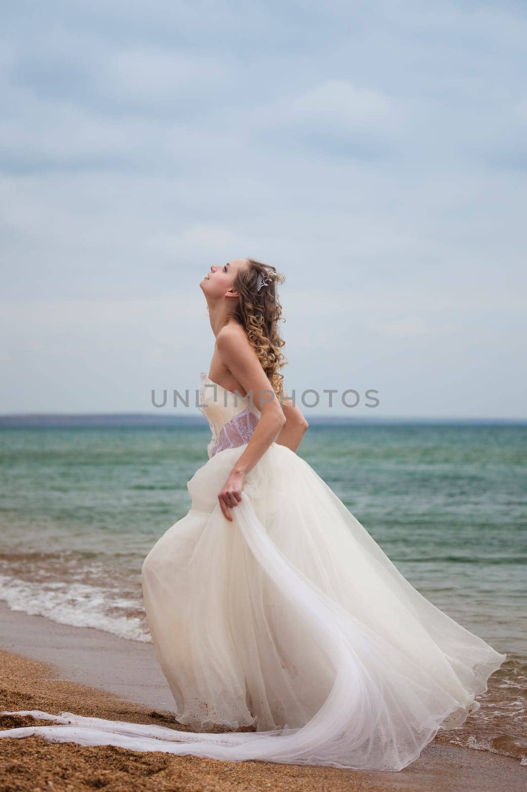 beautiful bride  dancing on the beach