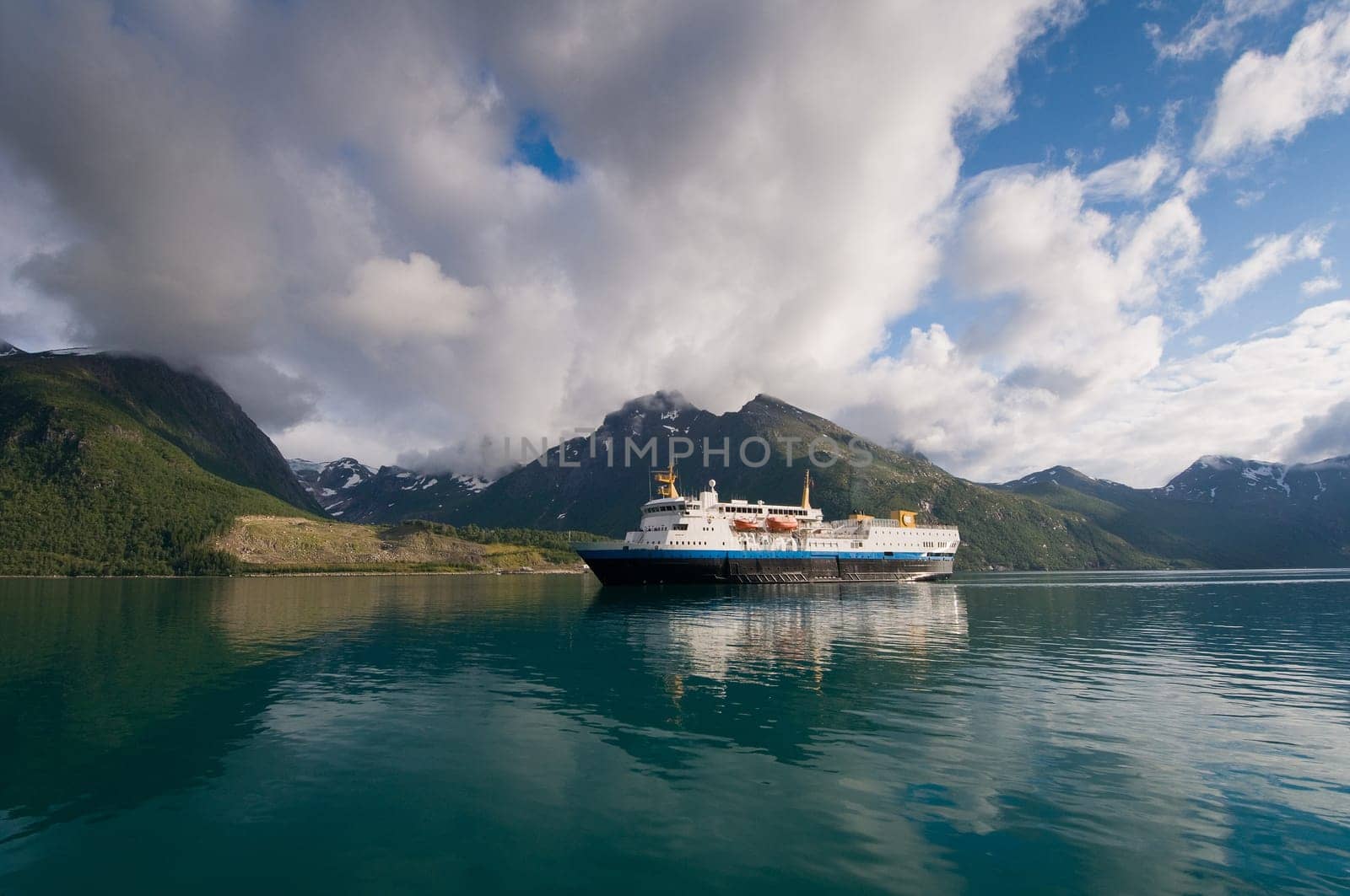Cruise ship on glacial water of Norwegian fjord