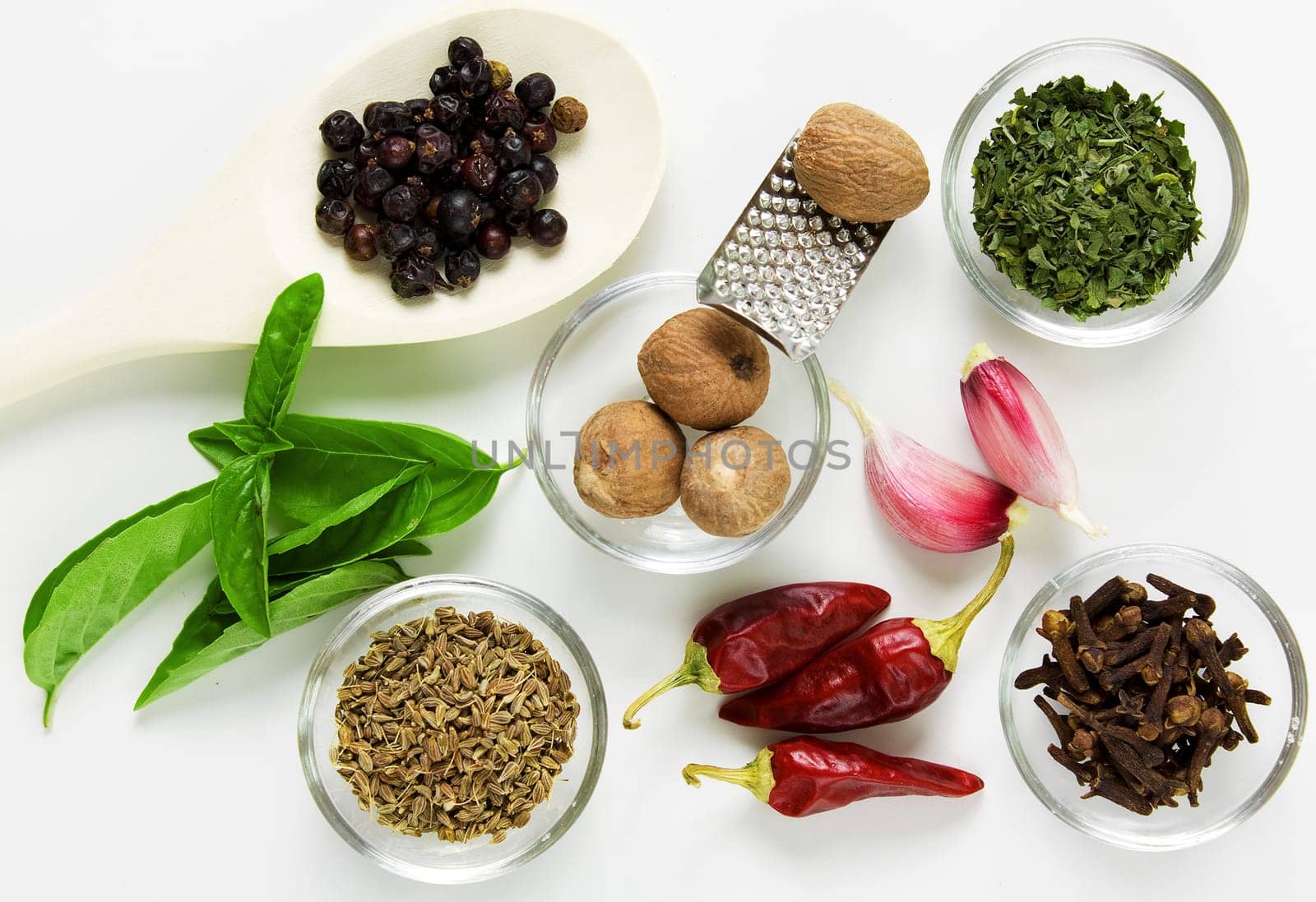 Different spices on the table on white