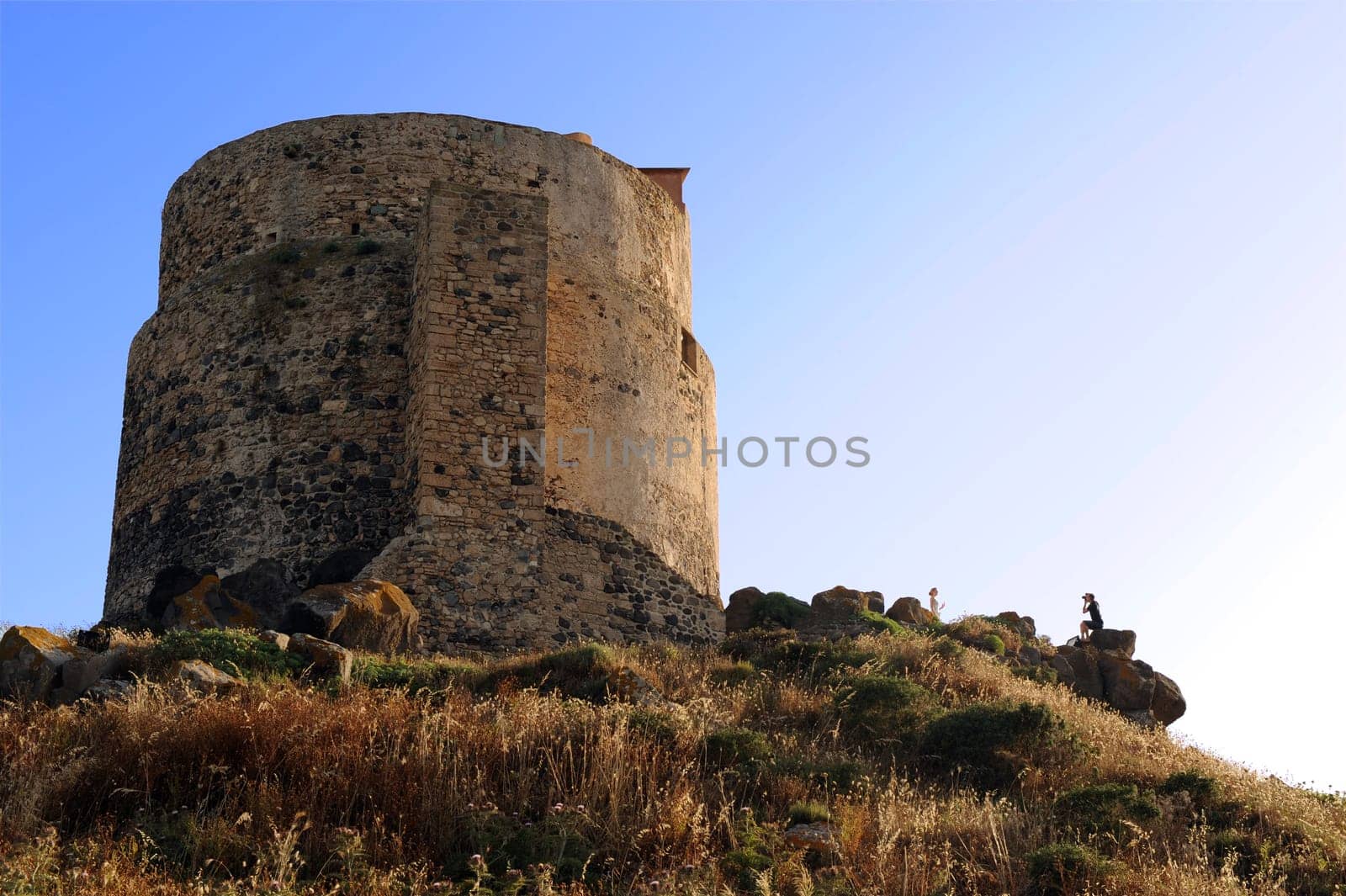tourists taking pictures on tharros hill tower