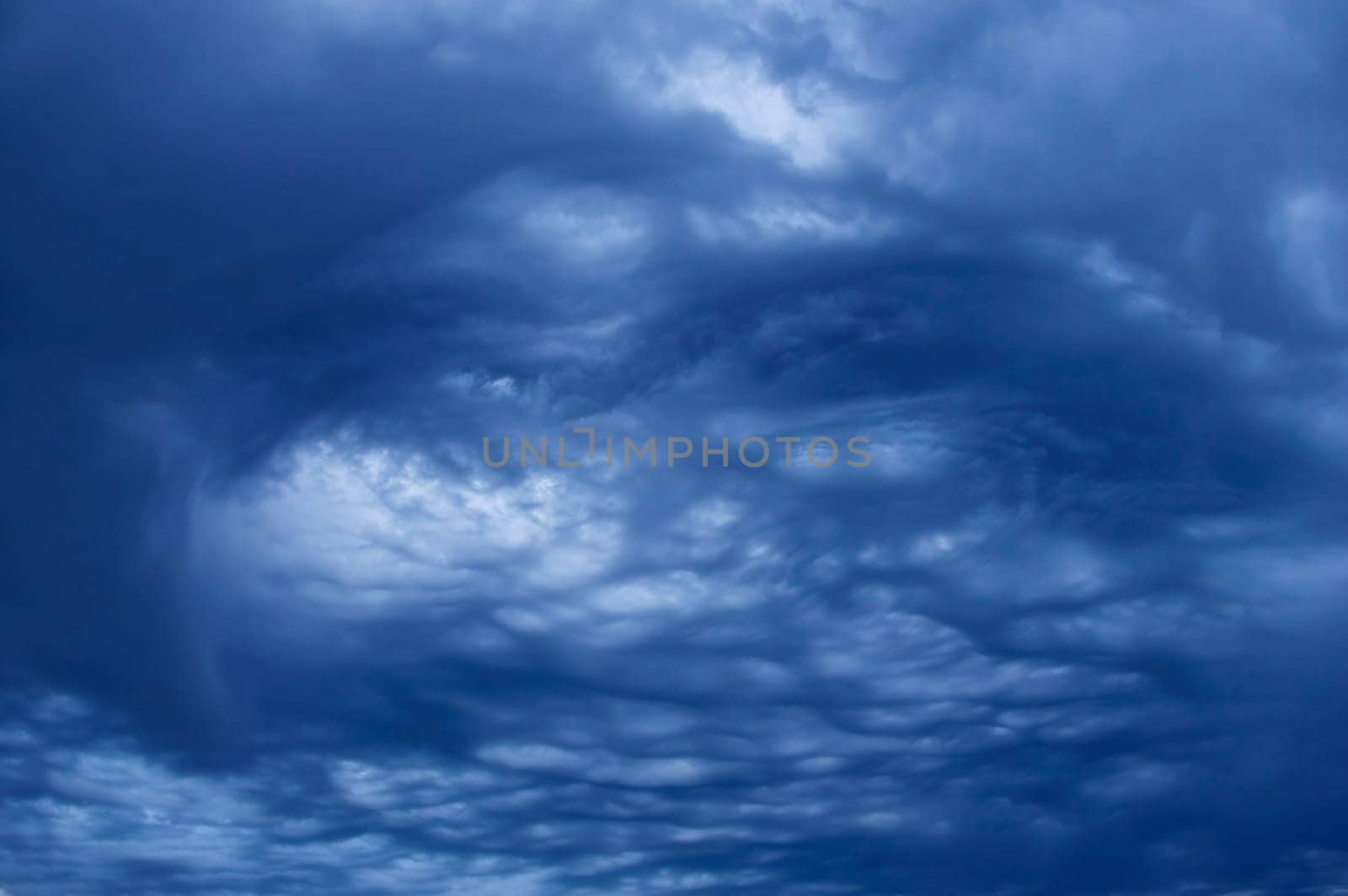 swirling blue storm clouds in sky
