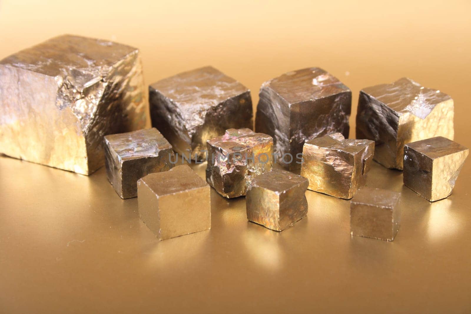 golden cubes on the golden background