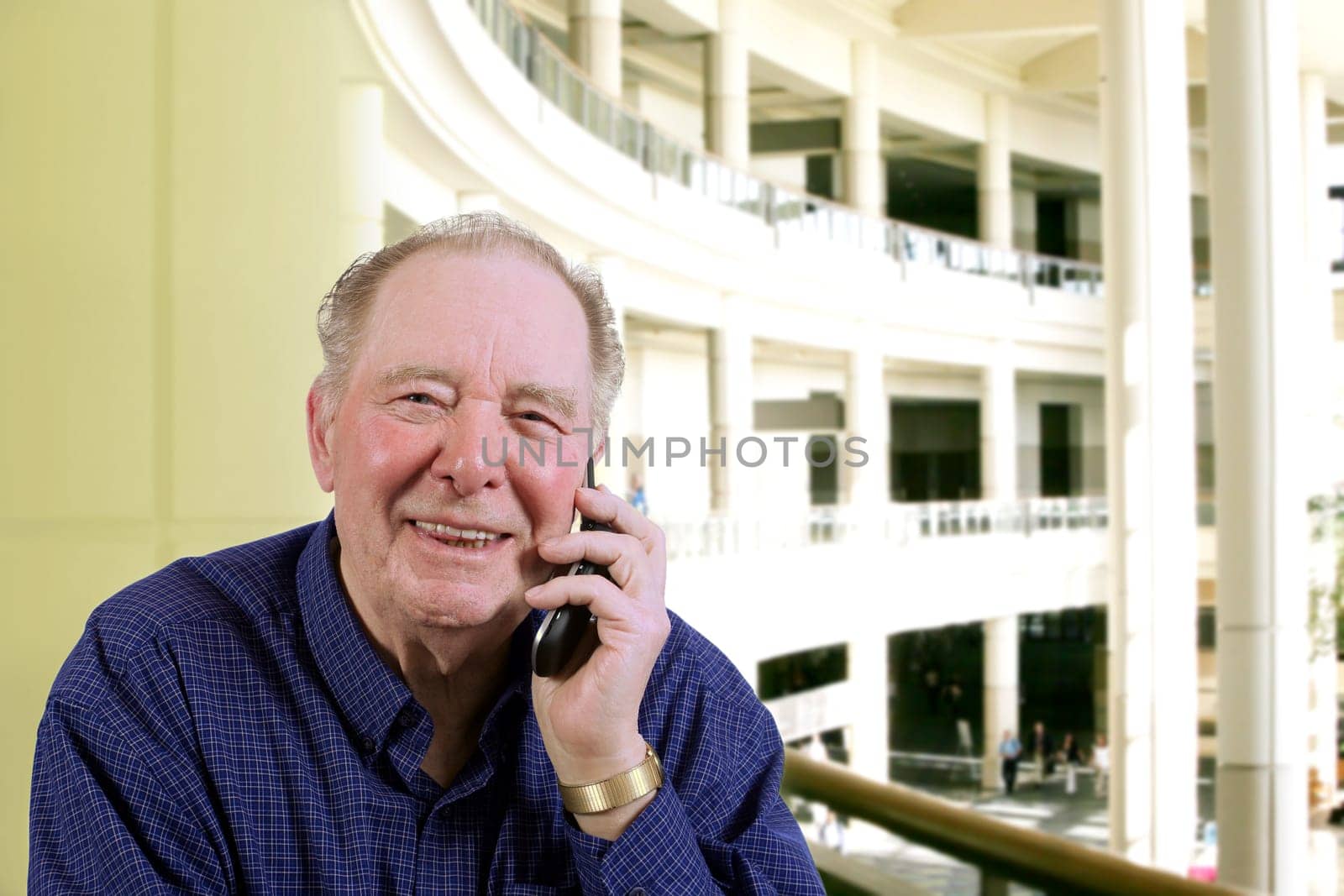 Elderly man talking on cell phone