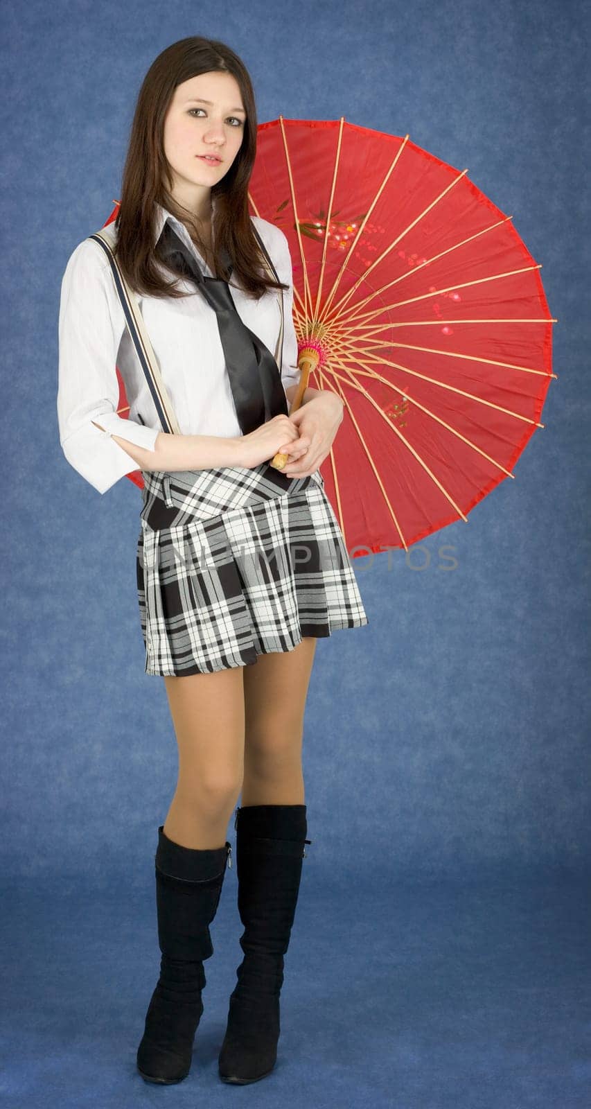 Portrait of the young woman with the Japanese umbrella in a hands