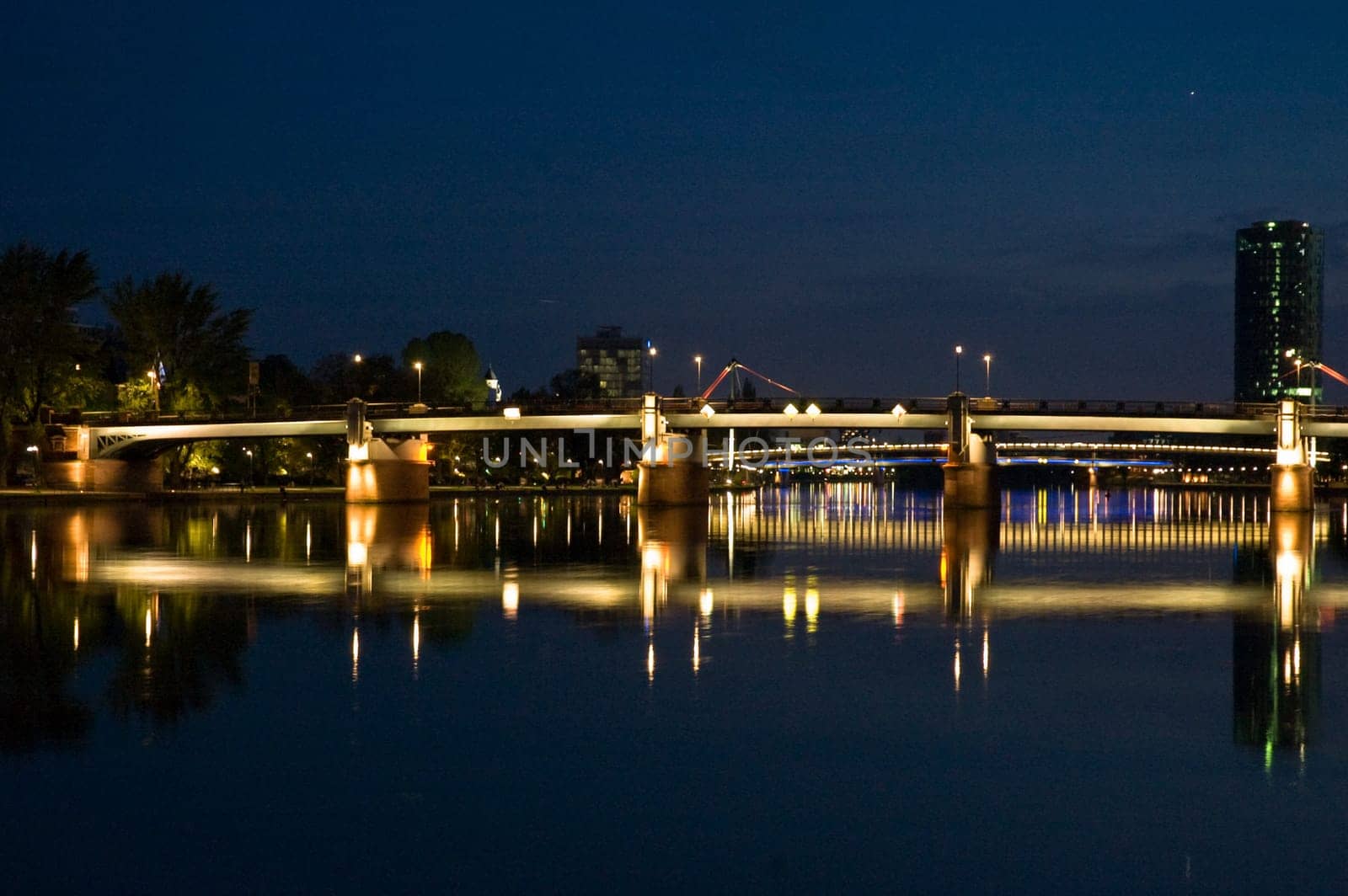 nightshot of frankfurt city including bridges and scyscrapers