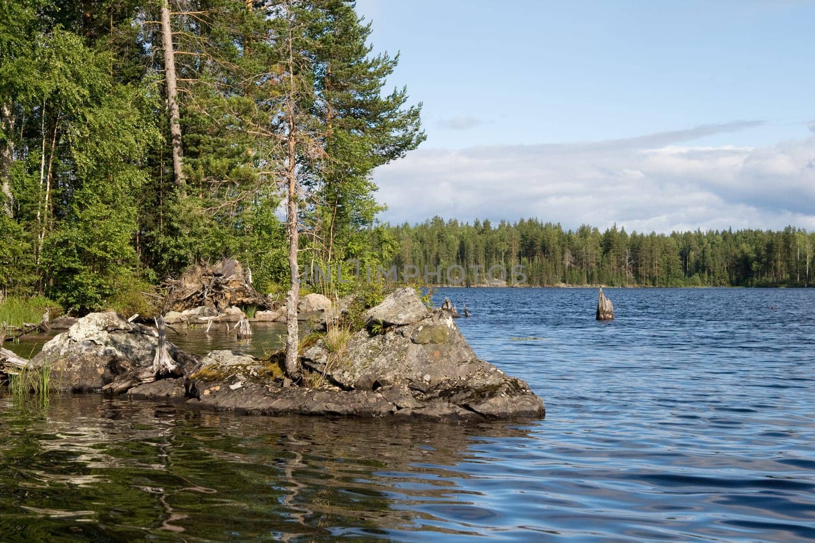 Landscape of Karelian lake and sky with clouds
