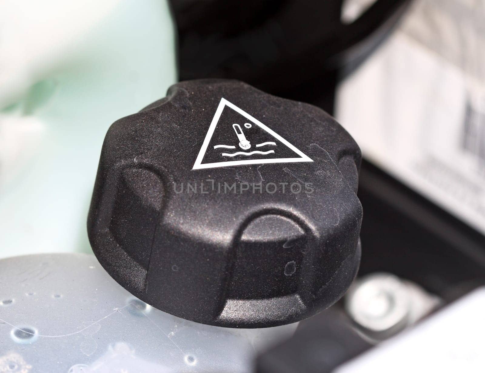 detail of modern car's engine, water place background