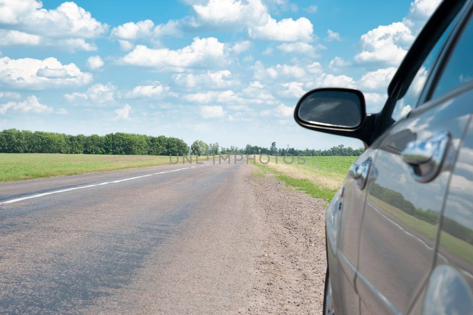 The car and road. A fragment of the car and a line