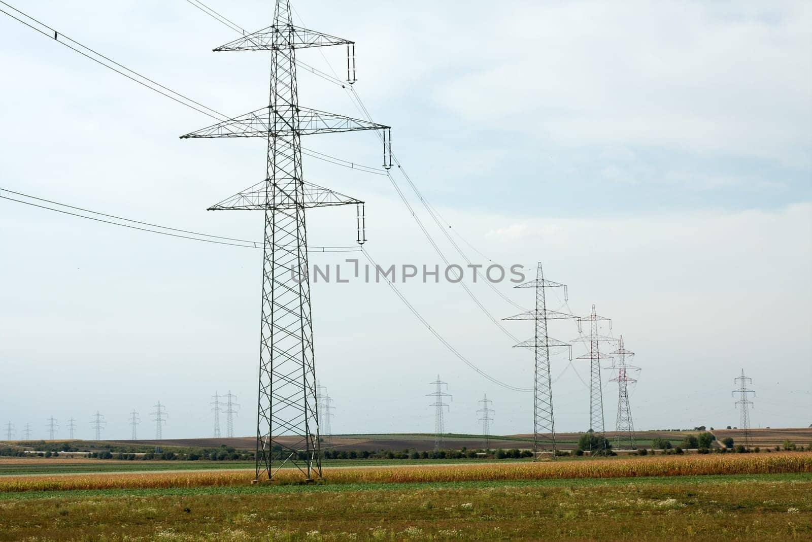 high voltage electric line going through a field