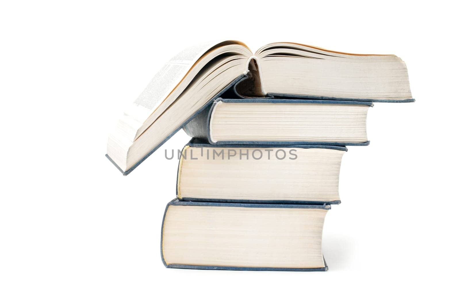 A pile of thick books isolated on a white