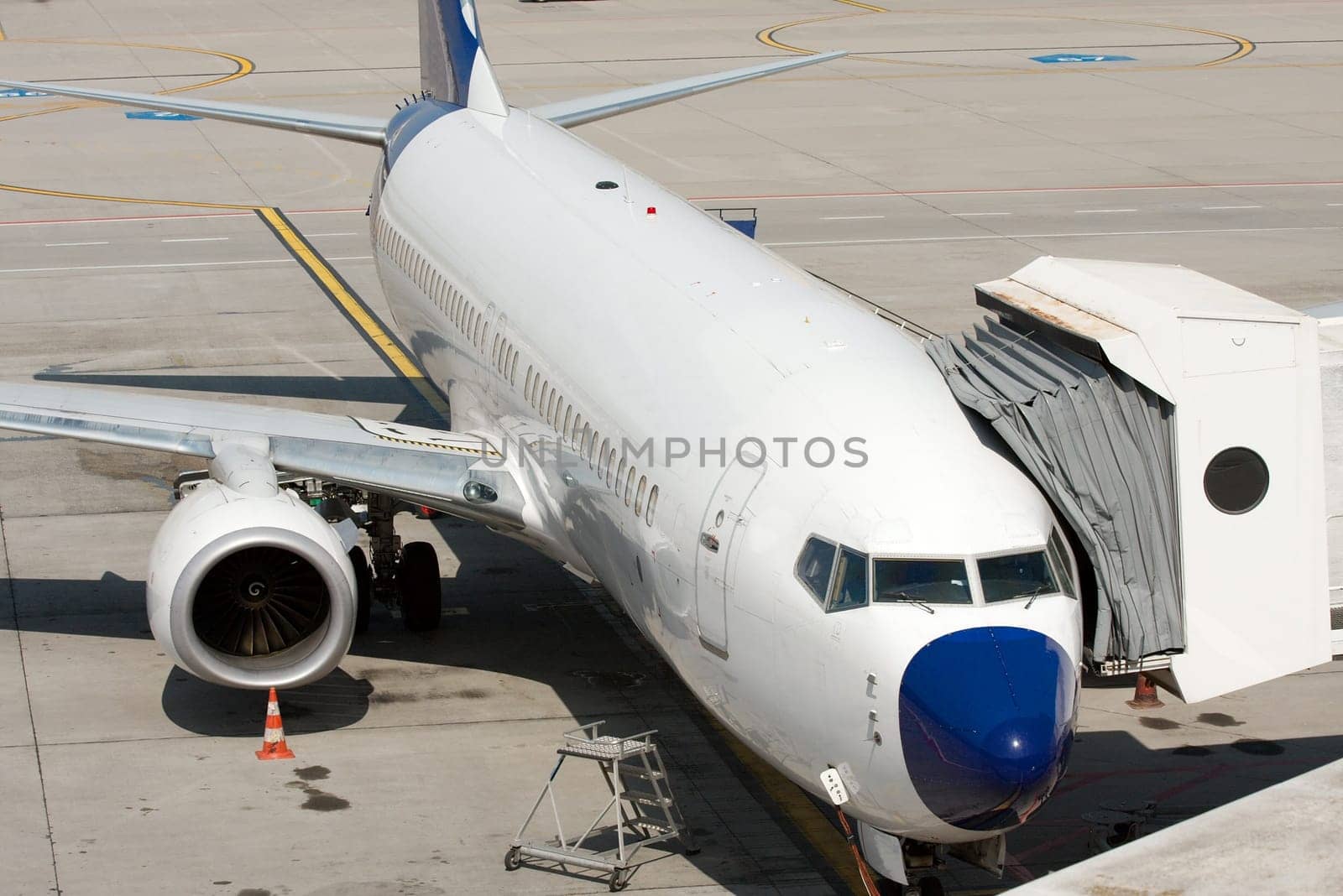 Commercial airplane parked at an airport terminal