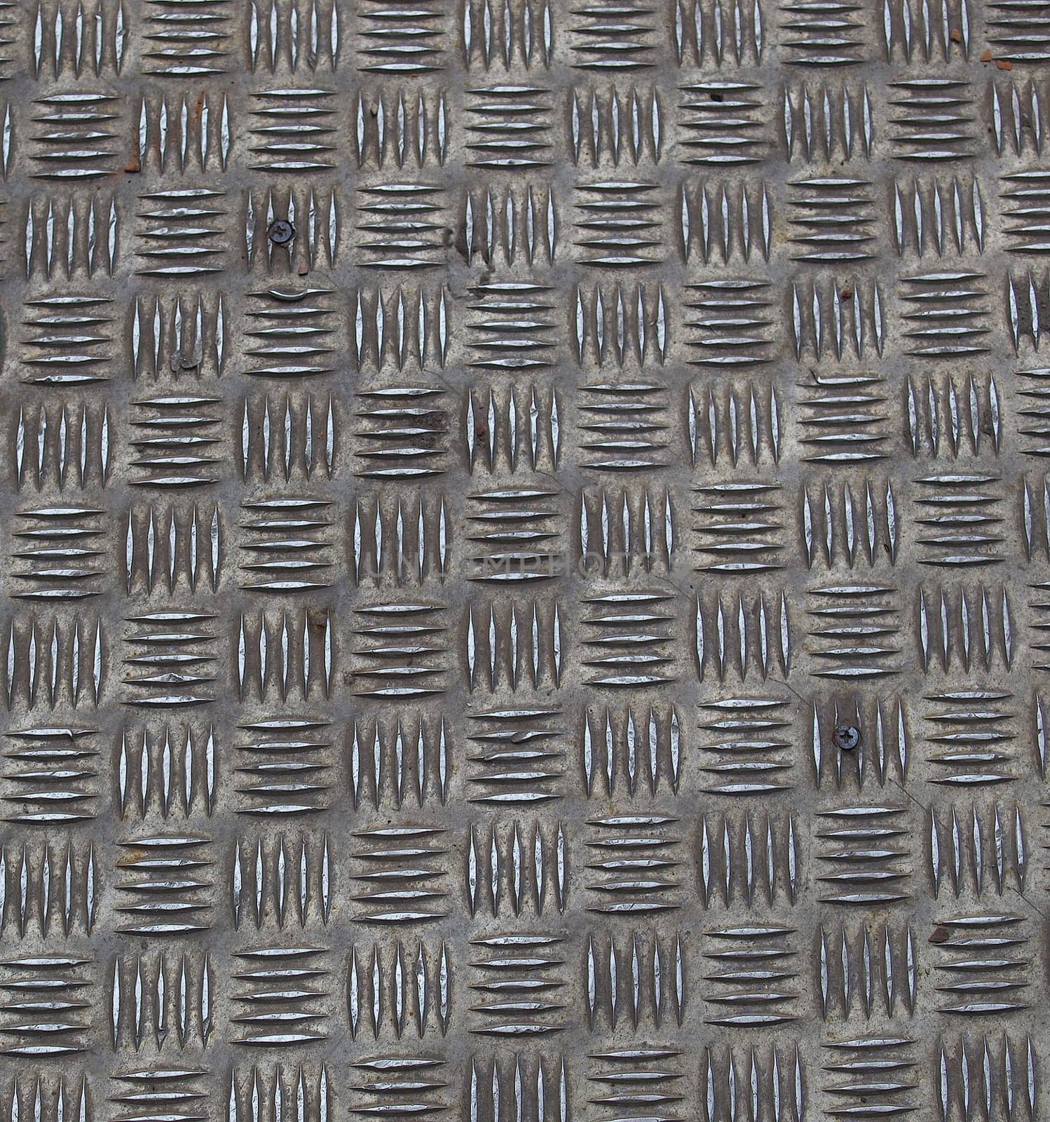 Diamond steel plate useful as a background