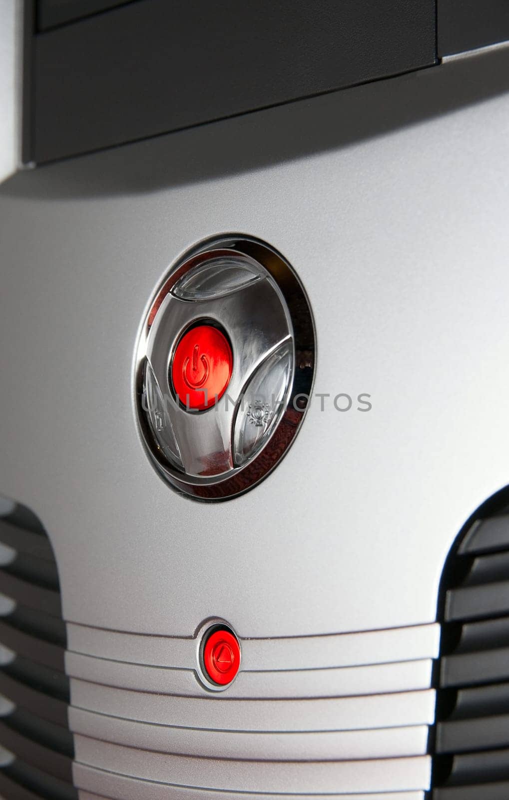 Close up of computer system box. Power and Reset button.