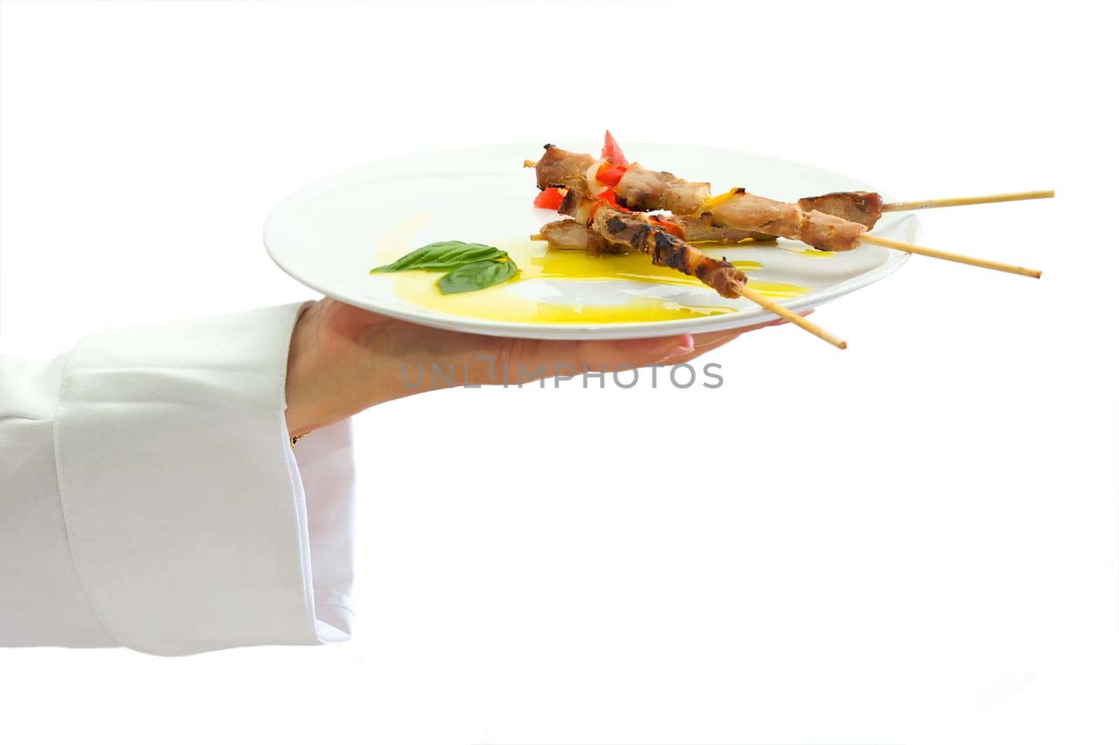 Skewer presentation from chef on white background